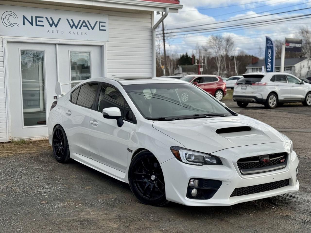 <div>CLEAN CARFAX, 2.5L DOHC Turbocharged SUBARU BOXER Engine - 305 hp and 290 lb-ft torque, 6-Speed Manual Transmission (6MT) - Close ratio, fully synchronized, Subaru Symmetrical Full-Time All-Wheel Drive - With multi-mode Driver Controlled Centre Differential (DCCD), Helical Limited-Slip Front Differential, TORSEN Limited-Slip Rear Differential, SI-DRIVE (Subaru Intelligent Drive) engine management system, Brembo High-Performance Brake System - Four-piston front and dual-piston rear calipers, Super Sport ABS with Brake Assist and EBD, Active Torque Vectoring System, Multi-Mode Vehicle Dynamics Control (VDC) System, High-Performance Suspension - STI-tuned 4-wheel independent system, 8-Way Power Drivers Seat, Heated Performance-Design Front Seats, Alcantara Upholstery with Red Leather Inserts - With red stitching, Flat-Bottom Leather-Wrapped Steering Wheel - With red stitching and integrated controls (audio, Bluetooth, and cruise control), Carbon Fiber Trim Accents, STI-Embroidered Floor Mats, Illuminated Steering Wheel-Mounted Audio and Bluetooth Controls, LED Low-Beam Automatic On/Off Headlights, Multi-Reflector Halogen Fog Lights, Power-Tilting and Sliding Glass Sunroof, 18-inch Cast Aluminum Alloy Wheels - With STI center caps, High-Profile Rear Spoiler, Functional Hood Scoop - For intercooler airflow, Aerodynamic Front Bumper and Side Ground Effects, Wide Front Fenders with Cooling Vents, Integrated LED Turn Signals in Power-Heated Door Mirrors, Body-Color Door Handles and Mirrors, Subaru Rear/Side Vehicle Detection (SRVD) System - Includes blind spot detection, lane change assist, and rear cross-traffic alert, Driver and Front Passenger Side-Impact Airbags, Side Curtain Airbags (front and rear), Drivers Knee Airbag, Ring-Shaped Reinforcement Frame, Collapsible Brake Pedal and Steering Column, 3-Point Seatbelts with Pretensioners and Load Limiters, Rear Child Safety Locks and ISO-FIX/LATCH Anchor System.</div><br /><div><br></div><div>Financing Available </div><div>Trades Welcome </div><div> </div><div>RIDE THE WAVE ADVANTAGE </div><div> </div><div>- Every vehicle comes with a fresh oil change and filter at the time of MVI</div><div>- Every vehicle comes with a brand-new 2-year Nova Scotia Motor Vehicle Safety Inspection</div><div>- Every vehicle comes with a complimentary 3-month warranty</div><div>- Every vehicle comes with a full tank of gas</div><div>- Every vehicle comes with a complete detail</div><div>- Every vehicle comes with a free Carfax</div><div>- Every vehicle is undercoated</div><div>- Every vehicle is delivered for free</div><div>- $300 referral bonus if friends or family purchase with us as well</div>