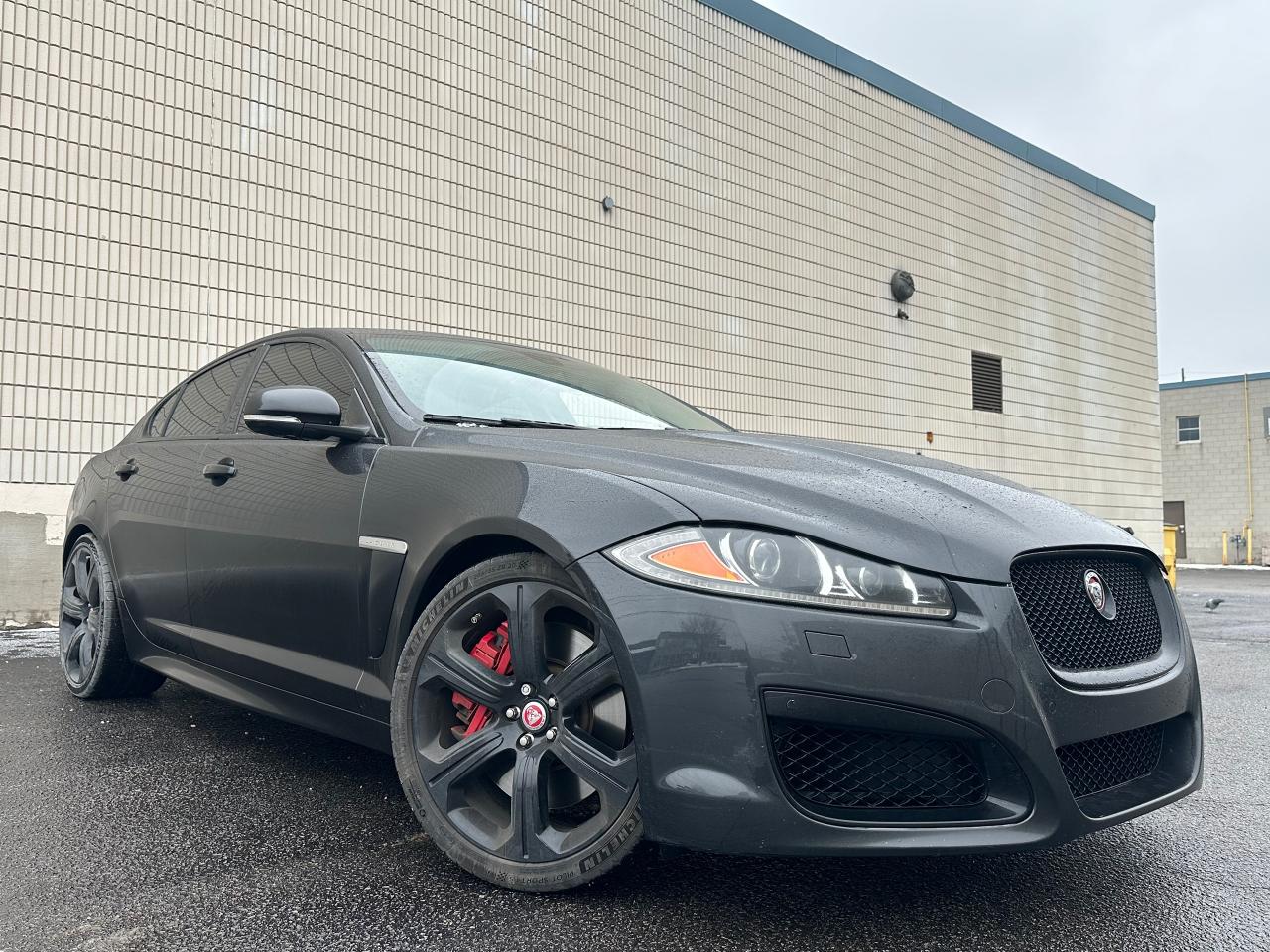 <p>*SAFETY CERTIFICATION INCLUDED**VERY RARE VEHICLE**510 HP*FINANCING AVAILABLE*28 SERVICE RECORDS!!*</p><p>INSANE CONDITION 2015 JAGUAR XFR 5.0L SUPERCHARGED V8 RWD FOR SALE!! AMAZING VEHICLE WITH LOTS OF EYEBALL, LEATHER AND CARBON FIBRE!! UNDERBODY IS VERY CLEAN WITH NO OIL OR COOLANT LEAKS, LOTS OF SERVICE OVER THE 10 YEARS OF ITS LIFE! VEHICLE JUST HAD 2 REAR MICHELIN PILOT SPORT 5 S TYRES PUT ON FOR $1,450!! VEHICLE IS EQUIPPED WITH 20 UPGRADED BLACK ALLOY RIMS ON HIGH PERFORMANCE MICHELIN TIRES, FACTORY NAVIGATION, RETRACTABLE SUNROOF, ALCANTARA ROOF LINER, CARBON FIBRE INTERIOR TRIM, HEATED AND COOLED PREMIUM LEATHER SEATS, BLUETOOTH CONNECTIVITY, BLIND SPOT MONITORING SYSTEM, R BRANDED SPORT BUCKET SEATS, AND THE BEST PART, THE 5.0L SUPERCHARGED V8 PRODUCING 510HP AND 461 LB-FT OF TORQUE! VEHICLE IS BEING SOLD CERTIFIED WITH A SAFETY STANDARDS CERTIFICATE FOR THE BLOWOUT PRICE OF $22,799 + TAX! 6 MONTH WARRANTY INCLUDED IN THE PURCHASE PRICE, ADDITIONAL WARRANTIES FOR PURCHASE. FINANCING AVAILABLE!! TO BOOK A TEST DRIVE OR REQUEST A COPY OF THE CARFAX PLEASE CALL BRYAN AT 647-862-7904</p><p>Auto Resale Inc</p><p>56 Martin Ross Ave</p><p>647-862-7904</p>