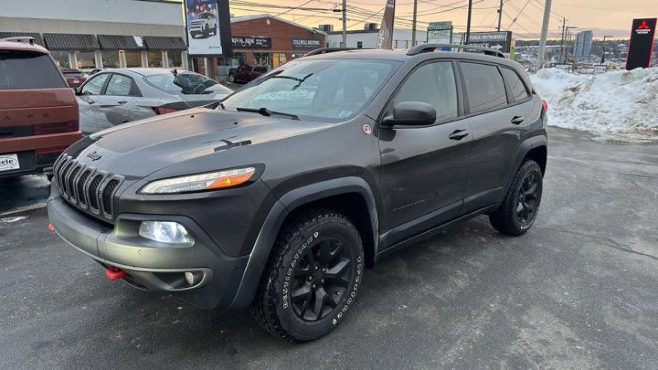 The 2016 Jeep Cherokee Trailhawk is an off-road-oriented SUV known for its rugged capabilities and distinctive design. Heres a detailed overview:Key Features:Engine Options:Standard: 3.2L Pentastar V6 engine producing 271 horsepower and 239 lb-ft of torque.Optional: 2.4L Tigershark MultiAir I4 engine producing 184 horsepower and 171 lb-ft of torque.Both engines come paired with a 9-speed automatic transmission.Four-Wheel Drive:Features Jeeps Active Drive Lock 4x4 system with a locking rear differential.Equipped with Selec-Terrain Traction Management System for Snow, Sand/Mud, Rock, and Sport modes.Off-Road Capability:Trail Rated Badge signifies enhanced off-road prowess.Skid plates, increased ground clearance, tow hooks (red-accented), and an off-road suspension system.Approach, departure, and breakover angles optimized for challenging terrains.Interior:Durable yet comfortable materials with premium finishes on higher trims.Uconnect infotainment system with a 5-inch or optional 8.4-inch touchscreen.Options for leather upholstery, heated/ventilated front seats, and a heated steering wheel.Safety:Available advanced features: blind-spot monitoring, forward collision warning with active braking, lane departure warning, and rear cross-path detection.Standard: 10 airbags, electronic stability control, and hill-start assist.Towing Capacity:Up to 4,500 pounds with the V6 engine and the trailer tow package.