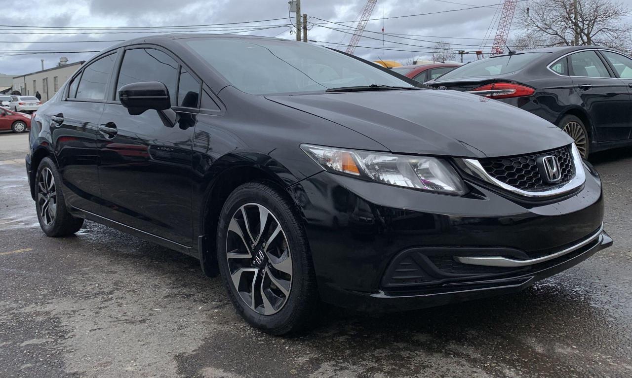 <p>Looking for a reliable and stylish sedan? Look no further than this 2015 Honda Civic EX from Hansen Truck and Car Sales! This sleek black beauty boasts a comfortable black interior, perfect for those who appreciate a sophisticated ride. With its 4-cylinder engine and smooth CVT transmission, this Civic offers a satisfying blend of power and fuel efficiency. This pre-owned gem has 182,000km on the odometer and is packed with features to enhance your driving experience.</p><p>Enjoy the convenience of keyless entry, heated seats and mirrors, and a sunroof to let in the sunshine. Stay connected on the road with Bluetooth connectivity and SiriusXM radio. This Honda Civic EX is a perfect blend of style, comfort, and practicality, making it an ideal choice for daily commutes, weekend adventures, or anything in between.</p><p>Here are 5 features to get you excited:</p><ol><li><strong>Sunroof:</strong> Enjoy the open-air feeling with the touch of a button.</li><li><strong>Heated Seats:</strong> Stay cozy and comfortable even on the coldest days.</li><li><strong>Keyless Entry:</strong> Unlock your Civic with ease, no fumbling for keys required.</li><li><strong>Heated Mirrors:</strong> Enjoy clear visibility, even on frosty mornings.</li><li><strong>SiriusXM Radio:</strong> Listen to your favorite channels and discover new music with crystal clear reception.</li></ol><p><em>COMES CERTIFIED AND 90 DAYS BUMPER TO BUMPER SHOP WARRANTY.</em></p>