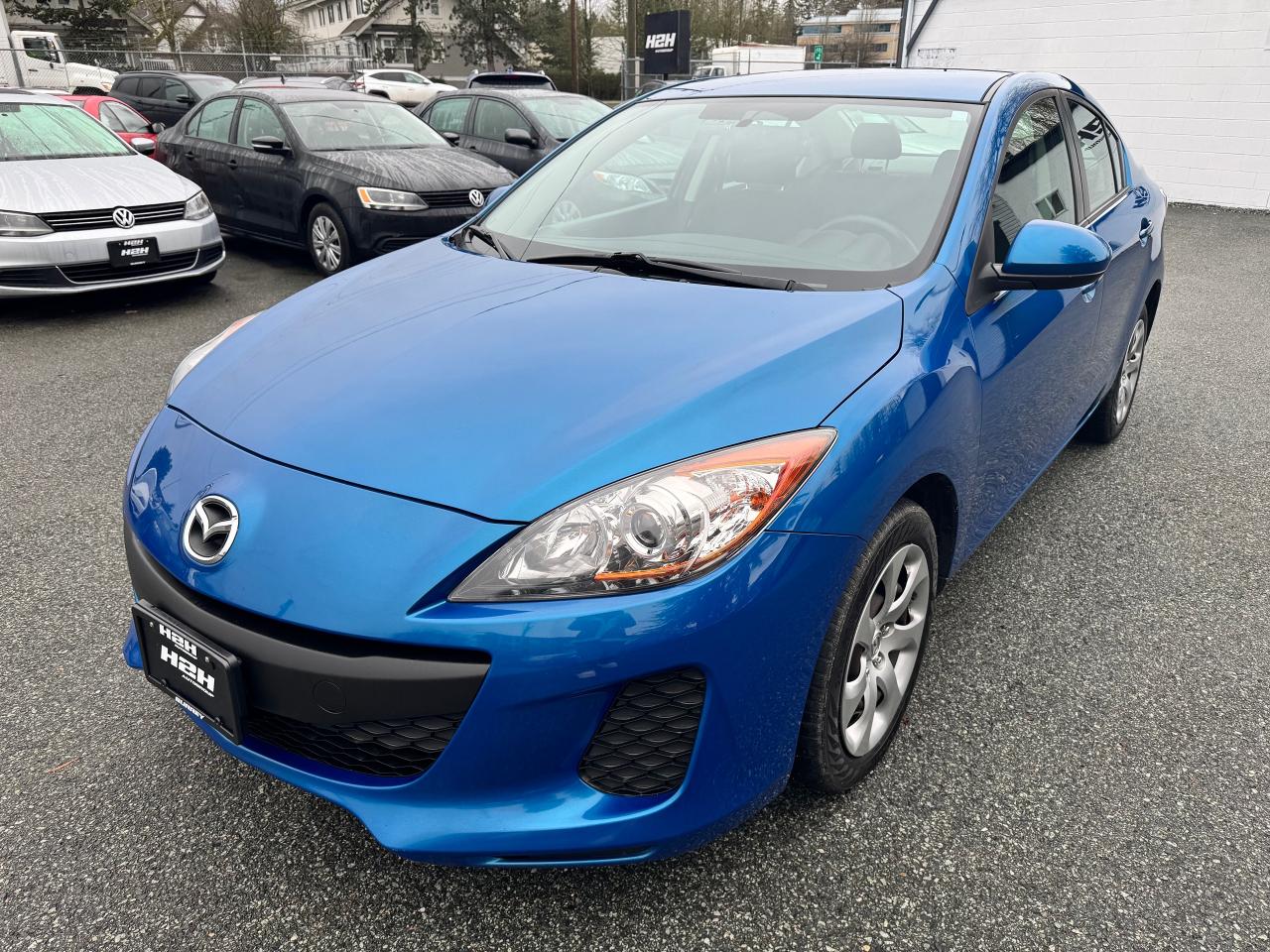 <p>This 2013 Mazda MAZDA3 4DR SDN AUTO, available at H2H Auto Group, is a stylish and reliable sedan thats ready to take you wherever you need to go. With its sleek blue exterior and comfortable interior, this Mazda is perfect for both city driving and weekend adventures. The 4-cylinder engine delivers peppy performance while remaining fuel-efficient, making it a smart choice for your daily commute. This well-maintained car has 166,435km on the odometer, and its packed with features that will make your driving experience even more enjoyable.</p><p>Ready to experience a blend of style and comfort? This MAZDA3 boasts an array of features that are sure to impress. Enjoy the convenience of keyless entry, cruise comfortably with power windows and locks, and stay connected with the AM/FM radio and auxiliary audio input. Stay safe and secure with features like anti-lock brakes, stability control, and multiple airbags. This vehicle comes equipped with a temporary spare tire, ensuring youre prepared for any situation on the road.</p><p><em>Powered by AutoIntelligence™ AI</em></p>