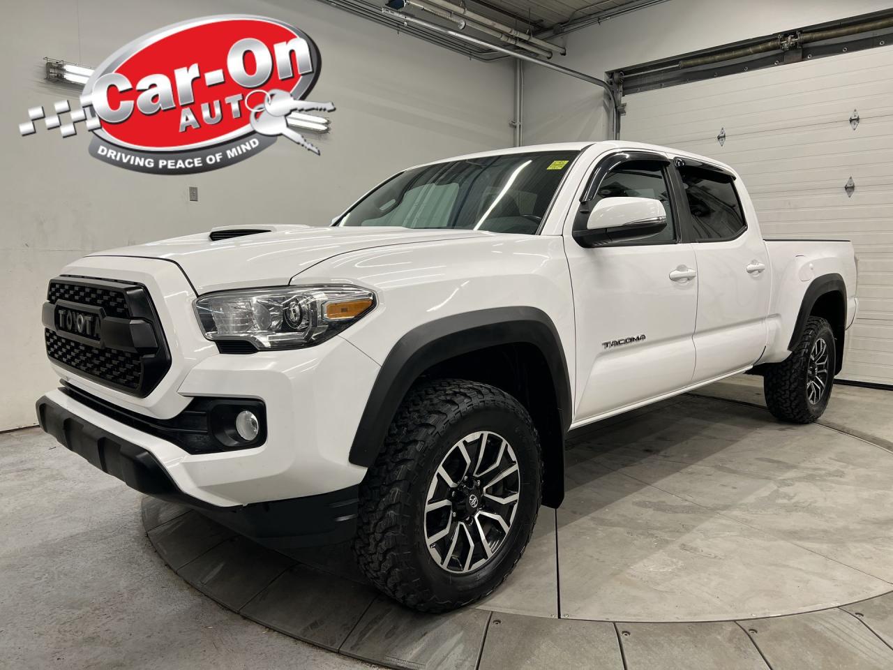 LOADED DOUBLE CAB TRD SPORT PREMIUM W/ 3.5L V6!! Leather, sunroof, heated seats, navigation, blind spot monitor, rear cross-traffic alert, lane-departure alert, pre-collision system, adaptive cruise control, backup camera, Apple CarPlay/Android Auto, 17-inch alloys, wireless charger, dual-zone climate control, power seat, automatic headlights w/ auto highbeams, auto-dimming rearview mirror, garage door opener, tow package (6,400lb capacity), 6-foot box w/ bedliner, keyless entry w/ push start, leather-wrapped steering wheel, Bluetooth, fog lights and Sirius XM!