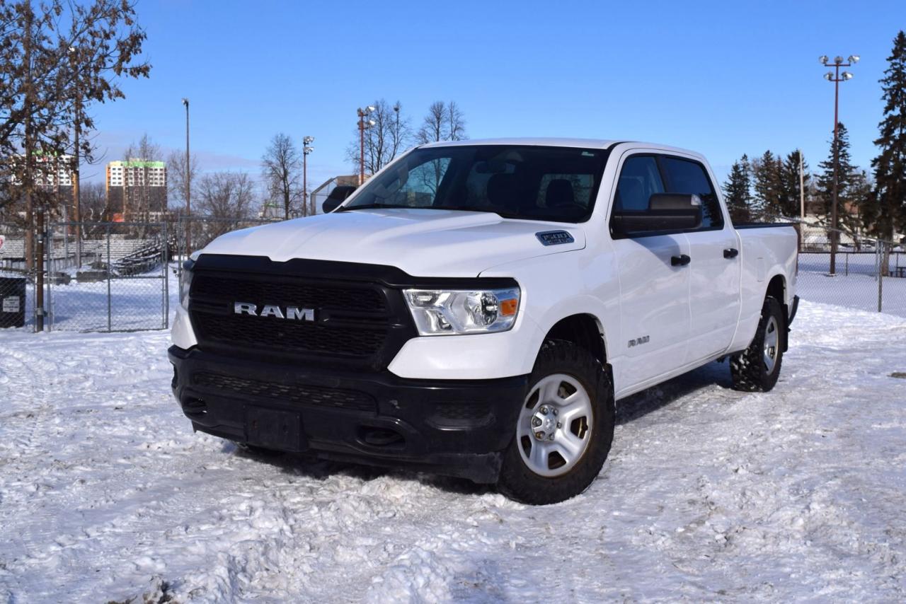 <div>Get the job done with this <strong data-start=96 data-end=145>2021 RAM 1500 Tradesman Crew Cab Long Box 4X4</strong>, featuring the <strong data-start=161 data-end=179>new body style</strong> and a clean <strong data-start=192 data-end=208>Bright White</strong> exterior. With <strong data-start=224 data-end=237>86,000 km</strong>, this truck is built for hard work and everyday practicality.</div><h3 data-start=303 data-end=332><strong data-start=307 data-end=330>Power & Performance</strong></h3><ul data-start=333 data-end=684><li data-start=333 data-end=424><strong data-start=335 data-end=355>5.7L HEMI VVT V8</strong> with FuelSaver MDS for the perfect balance of power and efficiency</li><li data-start=425 data-end=507><strong data-start=427 data-end=461>8-speed automatic transmission</strong> for smooth shifting and optimal performance</li><li data-start=508 data-end=605><strong data-start=510 data-end=559>3.92 rear axle ratio & anti-spin differential</strong> for improved traction and towing capability</li><li data-start=606 data-end=684><strong data-start=608 data-end=643>Electronic shift-on-the-fly 4X4</strong> for enhanced control in any conditions</li></ul><h3 data-start=686 data-end=720><strong data-start=690 data-end=718>Capability & Convenience</strong></h3><ul data-start=721 data-end=1150><li data-start=721 data-end=874><strong data-start=723 data-end=744>Trailer Tow Group</strong> with <strong data-start=750 data-end=872>Class IV hitch receiver, trailer brake control, trailer tire pressure monitoring, and trailer reverse steering control</strong></li><li data-start=875 data-end=979><strong data-start=877 data-end=898>Bed Utility Group</strong> with <strong data-start=904 data-end=977>LED bed lighting, adjustable cargo tie-downs, and deployable bed step</strong></li><li data-start=980 data-end=1094><strong data-start=982 data-end=1002>Protection Group</strong> with <strong data-start=1008 data-end=1092>skid plates on the fuel tank, transfer case, front suspension, and steering gear</strong></li><li data-start=1095 data-end=1150><strong data-start=1097 data-end=1126>Rear power sliding window</strong> for added convenience</li></ul><h3 data-start=1152 data-end=1183><strong data-start=1156 data-end=1181>Technology & Interior</strong></h3><ul data-start=1184 data-end=1381><li data-start=1184 data-end=1252><strong data-start=1186 data-end=1210>8.4-inch touchscreen</strong> with <strong data-start=1216 data-end=1250>Apple CarPlay and Android Auto</strong></li><li data-start=1253 data-end=1312><strong data-start=1255 data-end=1283>SiriusXM satellite radio</strong> with a 1-year subscription</li><li data-start=1313 data-end=1381><strong data-start=1315 data-end=1353>Hands-free Bluetooth communication</strong> for seamless connectivity</li></ul><br /><div>This <strong data-start=1388 data-end=1410>RAM 1500 Tradesman</strong> is ready for work or play, combining power, capability, and modern technology. <strong data-start=1490 data-end=1522>Financing options available.</strong></div><br /><div><strong data-start=1526 data-end=1562 data-is-last-node=>Call today to book a test drive!</strong></div>