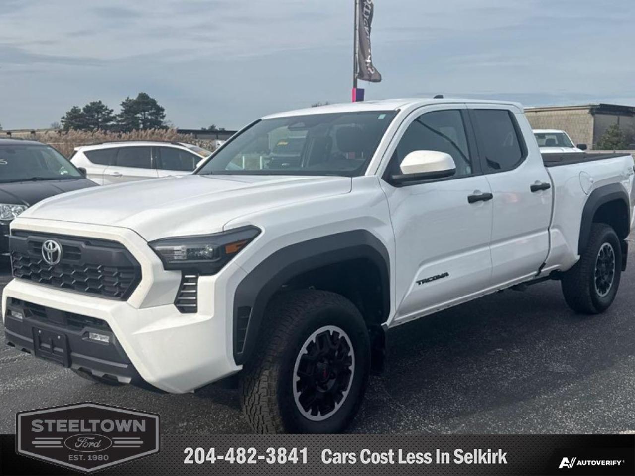 <b>Low Mileage!</b><br> <br> We value your TIME, we wont waste it or your gas is on us!   We offer extended test drives and if you cant make it out to us we will come straight to you!<br><br><br> <br>   Improved in nearly every way, this all-new modernized Tacoma can compete withand even beatits rivals. This  2024 Toyota Tacoma is fresh on our lot in Selkirk. <br> <br>The Toyota Tacoma has dominated the mid-size pickup truck segment for nearly two decades, and this all-new 2024 Tacoma aims to set a new standard for modern trucks. Completely redesigned and reimagined for model year 2024, the Tacoma is ready to help drivers tackle their ambitious adventure bucket lists. Not only does the all-new Taco have brawny bodywork, but its interior finally qualifies as contemporary, with an attractive aesthetic supplemented by crisp digital displays.This low mileage   4X4 pickup  has just 13,486 kms. Its  white in colour  . It has an automatic transmission and is powered by a  278HP 2.4L 4 Cylinder Engine. <br> <br>To apply right now for financing use this link : <a href=http://www.steeltownford.com/?https://CreditOnline.dealertrack.ca/Web/Default.aspx?Token=bf62ebad-31a4-49e3-93be-9b163c26b54c&La target=_blank>http://www.steeltownford.com/?https://CreditOnline.dealertrack.ca/Web/Default.aspx?Token=bf62ebad-31a4-49e3-93be-9b163c26b54c&La</a><br><br> <br/><br>Family owned and operated in Selkirk for 35 Years.  <br>Steeltown Ford is located just 20 minutes North of the Perimeter Hwy, with an onsite banking center that offers free consultations. <br>Ask about our special dealer rates available through all major banks and credit unions.<br><br><br>Steeltown Ford Protect Plus includes:<br>- Life Time Tire Warranty <br>Cars cost less in Selkirk <br><br>Dealer Permit # 1039<br><br><br> Come by and check out our fleet of 80+ used cars and trucks and 100+ new cars and trucks for sale in Selkirk.  o~o