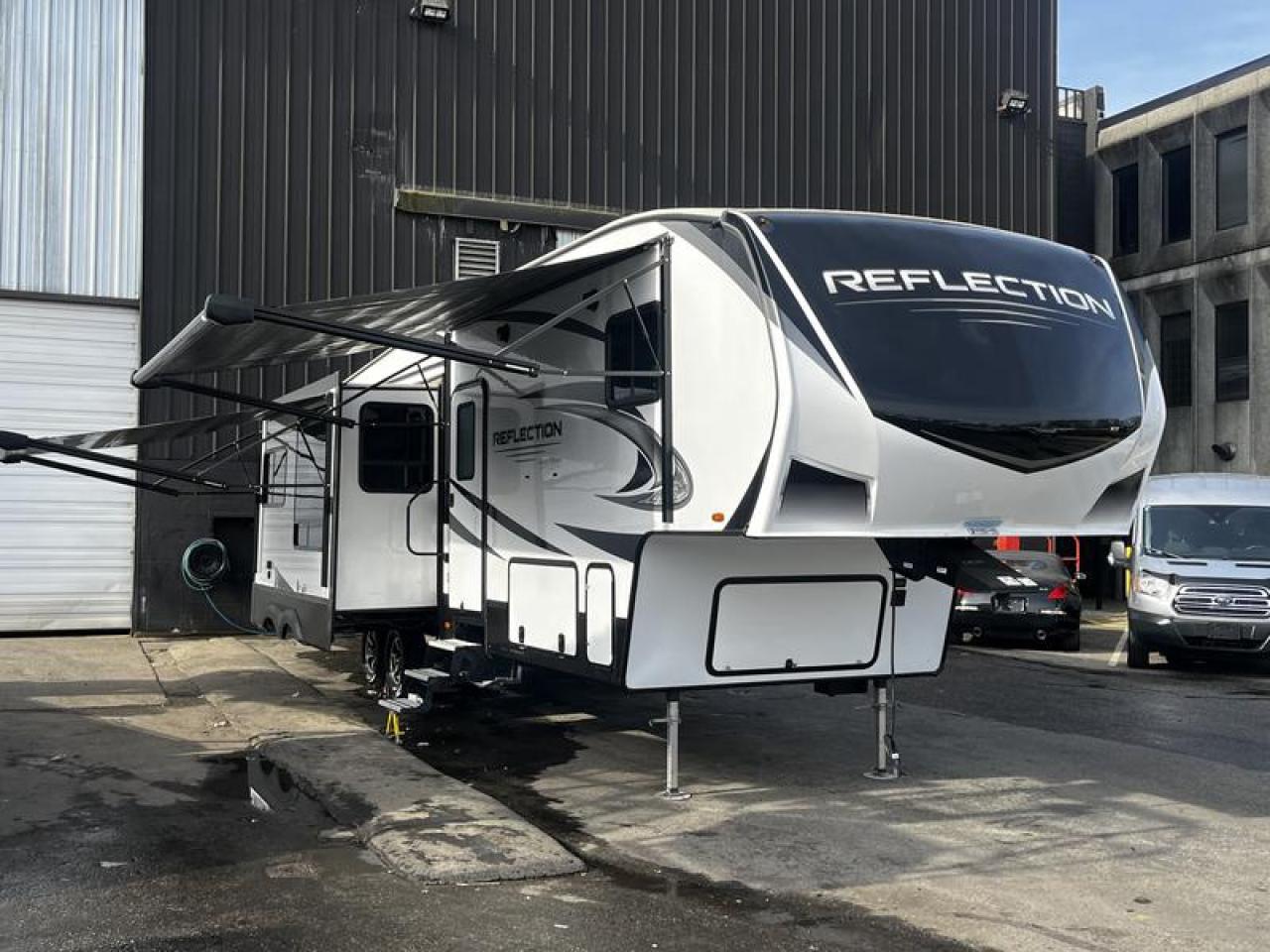 2021 Grand Design Reflection 311BHS 31 Foot Fifth Wheel Trailer with 4 Slides Out, 1 door, air conditioning, power retractable awning, 2 awnings, levelling jack, oven, 3 burner stove, refrigerator, sofa, 2 bunk beds, queen size bed, sofa bed, 2 sofa recliner, air conditioning, radio, interior/ exterior speakers, microwave, outside shower, outdoor  sink faucet, outdoor stove, kitchen sink, high-rise kitchen faucet, Led night lights, shower with glass door, AM/FM radio, white exterior. Length 36.83 feet,  Height 12.25 Feet,  Dry weight 11,185 lbs, Payload capacity 2810 lbs, GVWR 13,995 lbs, Hitch Weight 2,180 lbs , 60Gallon Fresh water capacity, Gray water capacity 87 gallon, Black water capacity 87 gallon.  $65,720.00 plus $375 processing fee, $66,095.00 total payment obligation before taxes.  Listing report, warranty, contract commitment cancellation fee, financing available on approved credit (some limitations and exceptions may apply). All above specifications and information is considered to be accurate but is not guaranteed and no opinion or advice is given as to whether this item should be purchased. We do not allow test drives due to theft, fraud, acts of vandalism and undetectable impaired driving. Instead we provide the following benefits: Complimentary Warranty (with options to extend), Limited Money Back Satisfaction Guarantee on Fully Completed Contracts, Contract Commitment Cancellation, and an Open-Ended Sell-Back Option. Ask seller for details or call 604-522-REPO(7376) to confirm listing availability.