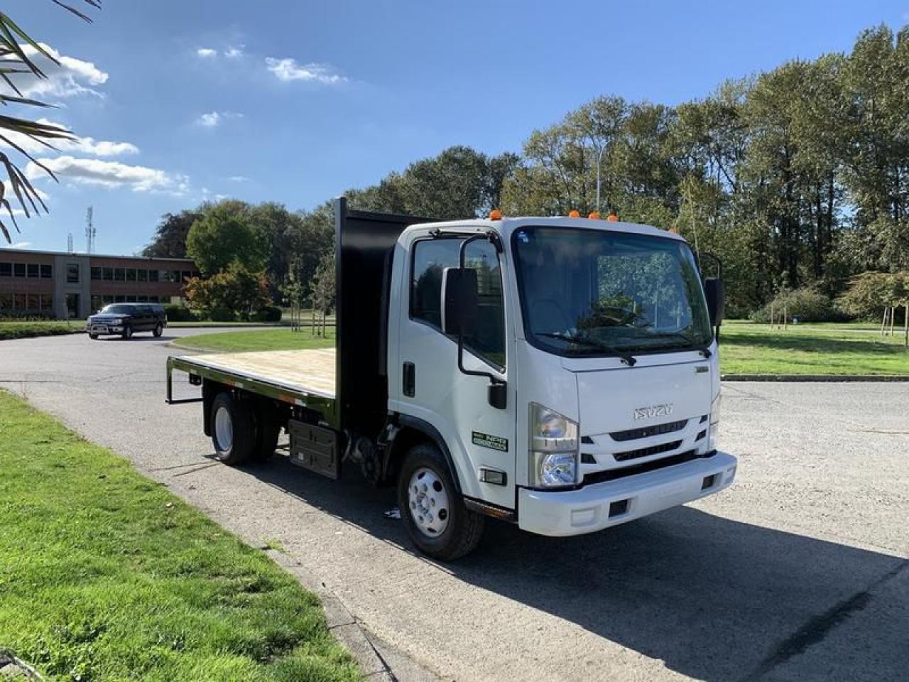 Used 2015 Isuzu NPR 12 Foot Flat Deck 3 seater Diesel for sale in Burnaby, BC