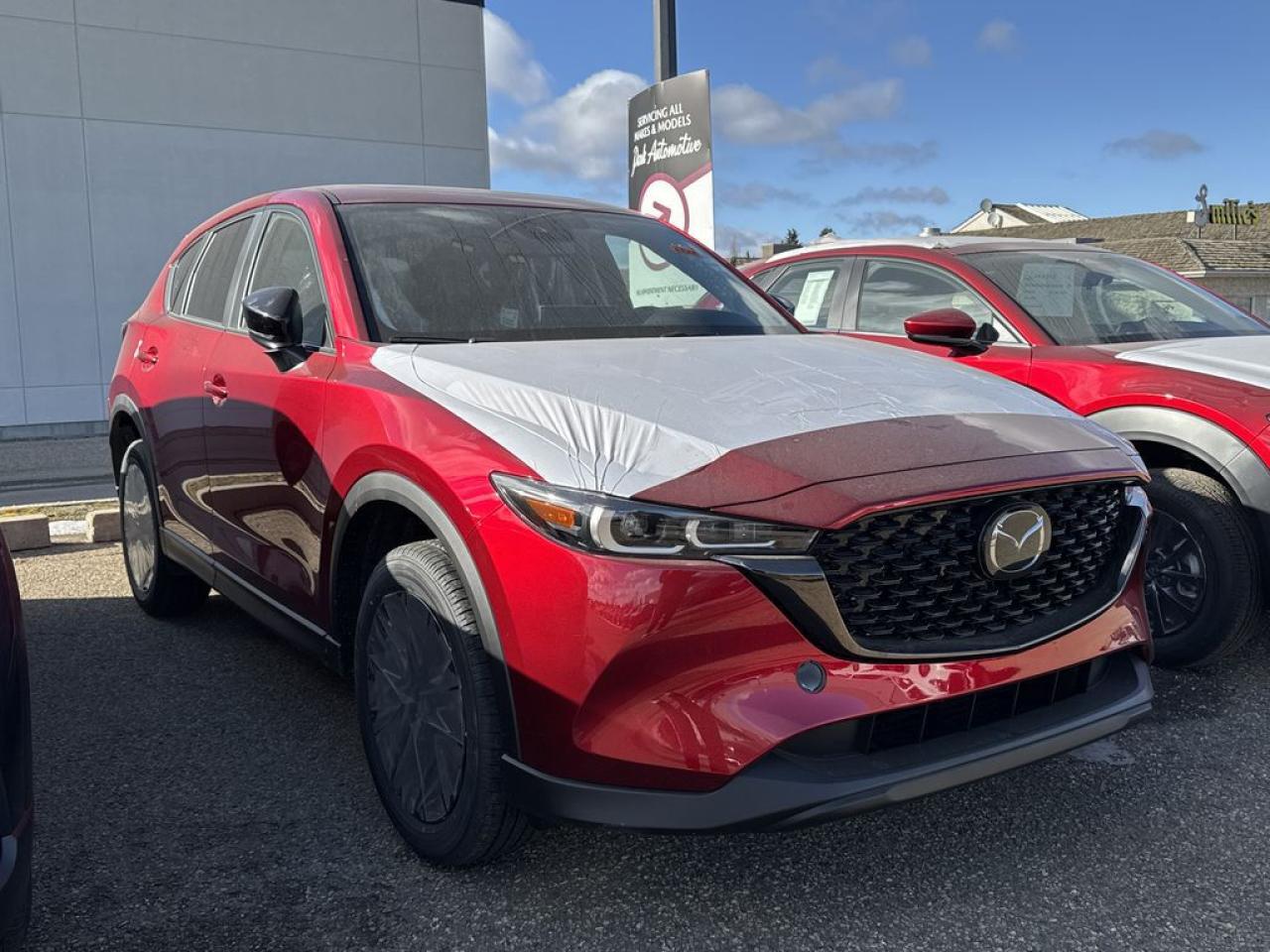 <p>NEW 2025 CX-5 Kuro AWD. Bluetooth, Skyactiv-G 2.5 L (Inline-4) Cylinder Deactivation. Backup Cam, Available NAV, Garnet Red Leather-Trimmed Upholstery, Memory Seat, Heated Seats, Keyless Remote Entry, Power Trunk, Adaptive Cruise Control, Heated Steering Wheel, Wiper Blade De-Icer, Auto Dual-Zone Climate Control, Rear Air Vents, Auto Rain-Sensing Wipers, Electronic Parking Brake, Heated Mirrors, 19 Black Metallic Alloy Wheels, Signature Wing Grille, Exterior Mirrors In Brilliant Black</p>  <p>Includes:</p> <p>i-ACTIVSENSE + Safety Features (Smart City Brake Support-Front, Rear Cross Traffic Alert, Mazda Radar Cruise Control With Stop & Go, Distance Recognition Support System, Lane-Keep Assist System, Lane Departure Warning System, Advanced Blind Spot Monitoring)</p>  <p>A joy to drive, our 2025 Mazda CX-5 Kuro AWD radiates refined style in Soul Red Crystal Metallic! Motivated by a 2.5 Liter 4 Cylinder that delivers 187hp tethered to a paddle-shifted 6 Speed Automatic transmission. You can put that strength to good use with the added traction of torque vectoring, and this All Wheel Drive SUV returns nearly approximately 7.8L/100km on the highway. Our CX-5 also has an expressive design with bold details like 17-inch alloy wheels, a rear roof spoiler, and bright-tipped dual exhaust outlets.</p>  <p>Our Kuro cabin is no ordinary interior. Its tailor-made for better travel with heated leather power front seats, a leather-wrapped steering wheel, automatic climate control, pushbutton ignition, and keyless access. Mazda makes connecting easy by providing a 10.25-inch central display, a multifunction Commander controller, Apple CarPlay/Android Auto, Bluetooth, voice control, and six-speaker audio. The versatile rear cargo space adds adventure-friendly functionality.</p>  <p>Safety is a high priority for Mazda, which helps protect you and your loved ones with automatic emergency braking, adaptive cruise control, a rearview camera, lane-keeping assistance, blind-spot monitoring, and other intelligent technologies. With all that, our CX-5 Kuro is here to transcend the ordinary!!</p>  <p>Call 587-409-5859 for more info or to schedule an appointment! Listed Pricing is valid for 72 hours. Financing is available, please see dealer for term availability and interest rates. AMVIC Licensed Business.</p>