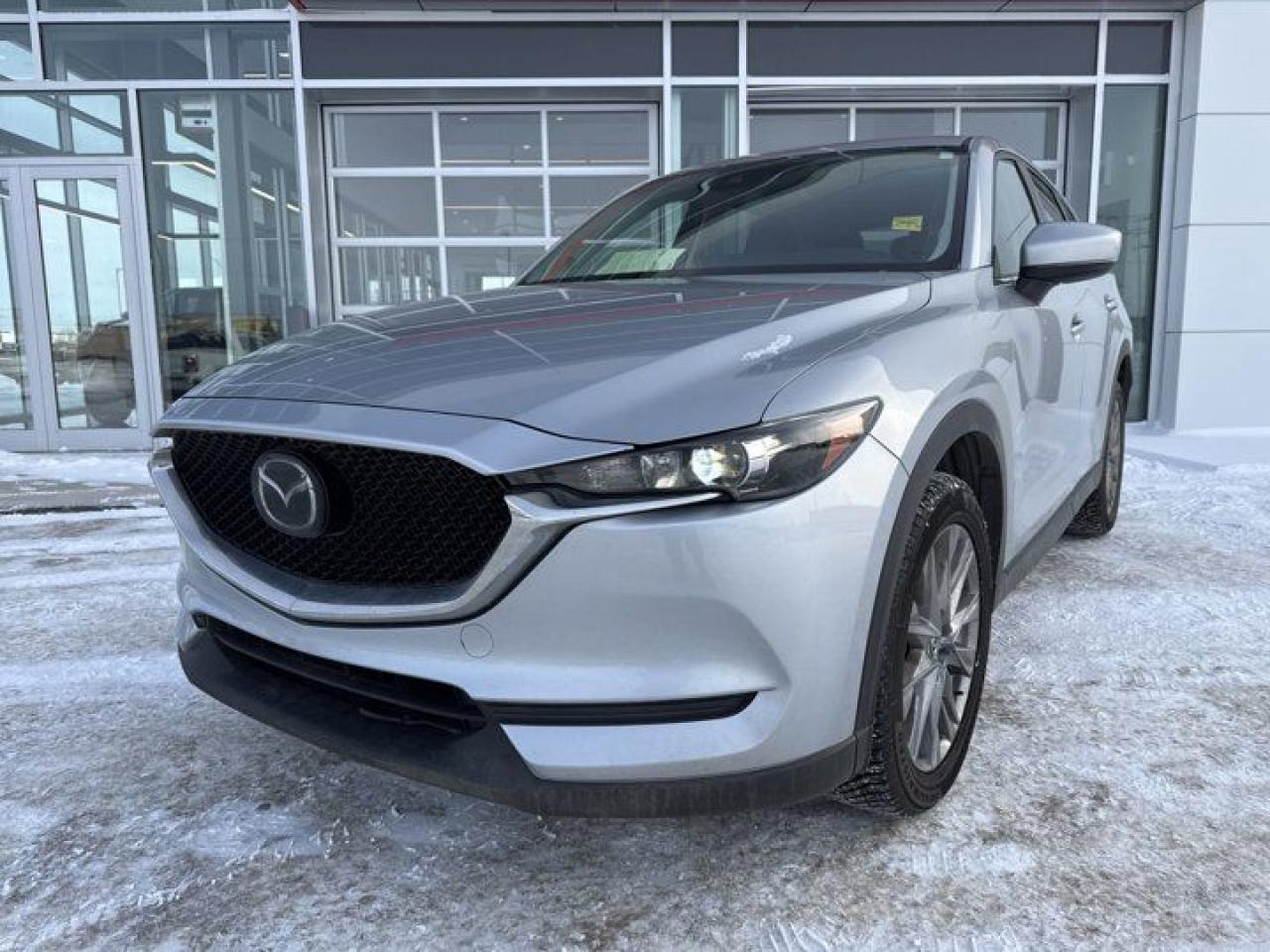 Check out this 2021 Mazda CX5! This all wheel drive comes equipped with a back up camera, Bluetooth, Apple Car Play, Android Auto, heated power seats, heated steering wheel, power lift gate, sunroof and so much more!This Mazda has passed the stringent 120 point inspection and comes with a fresh oil change so you can drive with confidence!