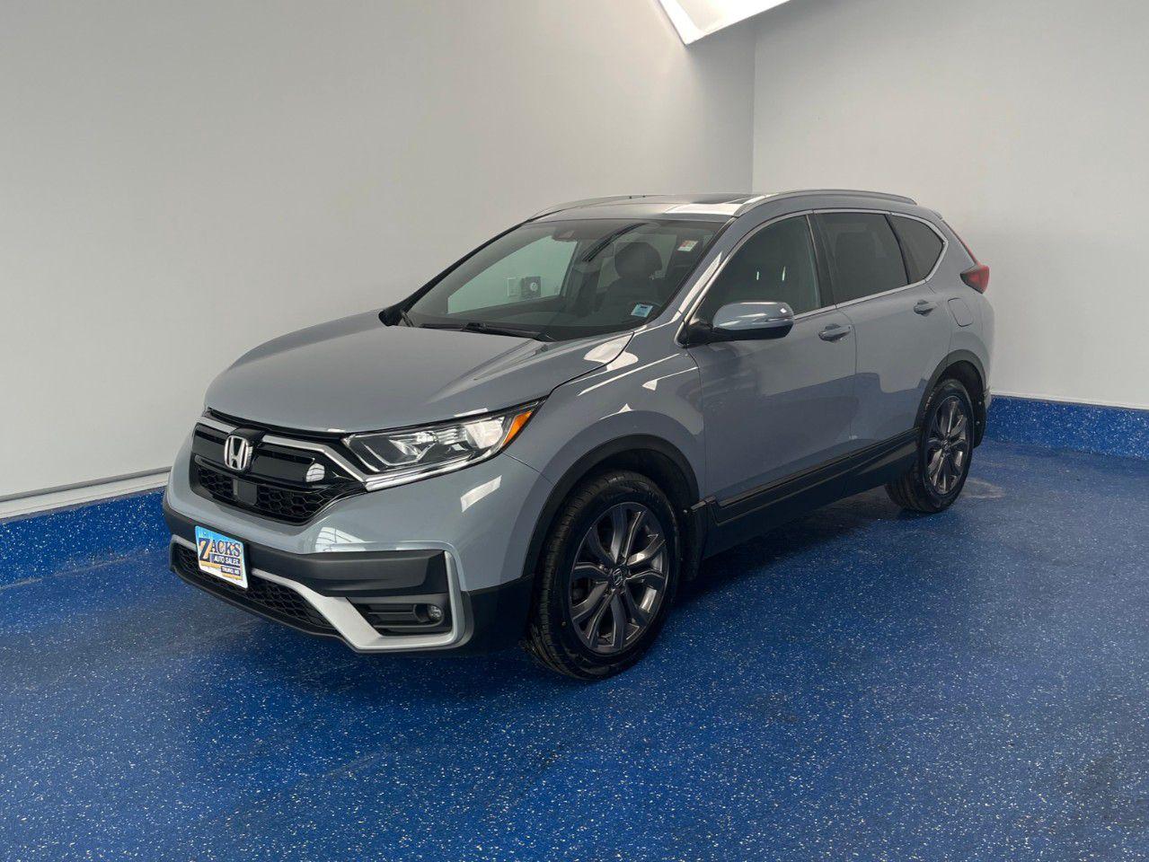 Recent Arrival! 2021 Honda CR-V Sport Sport AWD w/ Leather | Sunroof | Zacks Certified. CVT AWD Sonic Gray Pearl 1.5L I4 Turbocharged DOHC 16V LEV3-ULEV50 190hp<br /><br /><br />New Tires, AWD, Adaptive Cruise Control: Adaptive Cruise Control (ACC) with Low-Speed Follow, Air Conditioning, Apple CarPlay/Android Auto, Automatic temperature control, Exterior Parking Camera Rear, Forward collision: Collision Mitigation Braking System (CMBS) + FCW mitigation, Front fog lights, Heated Front Bucket Seats, Heated steering wheel, Leather Shift Knob, Leatherette/Fabric Seating Surfaces, Power driver seat, Power Liftgate, Power moonroof, Remote keyless entry, Tilt steering wheel, Wheels: 19''' Shark Grey Aluminum-Alloy.<br /><br />Certification Program Details: Fully Reconditioned | Fresh 2 Yr MVI | 30 day warranty* | 110 point inspection | Full tank of fuel | Krown rustproofed | Flexible financing options | Professionally detailed<br /><br />This vehicle is Zacks Certified! You're approved! We work with you. Together we'll find a solution that makes sense for your individual situation. Please visit us or call 902 843-3900 to learn about our great selection.<br /><br />With 22 lenders available Zack's Auto Sales can offer our customers with the lowest available interest rate. Thank you for taking the time to check out our selection!