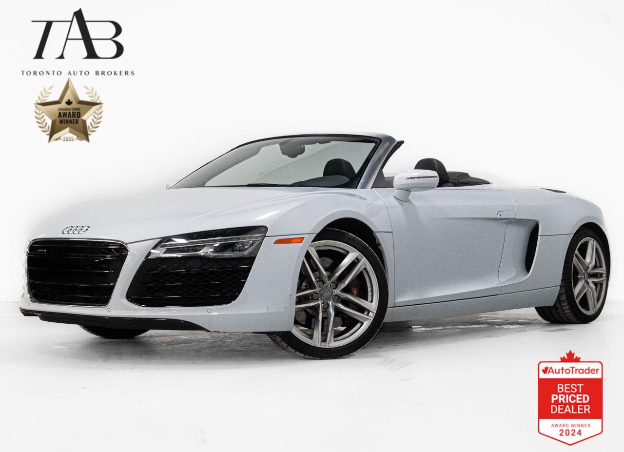 This beautiful 2014 Audi R8 Spyder is a Canadian vehicle with a clean Carfax report. The 2014 Audi R8 Spyder is the perfect blend of performance and luxury, offering an unforgettable open-air driving experience. With its manual transmission and a spine-tingling V8 engine, every shift and rev is pure excitement.

Key features Include:

4.2L V8 Engine
Manual 6-Speed Transmission
Audi Quattro All-Wheel Drive
Bang & Olufsen Premium Sound System
Convertible Soft-Top Roof
Magnetic Ride Control
Full LED Headlights
Audi MMI Navigation Plus
Xenon Plus Headlights
19-Inch Forged Aluminum Wheels
Leather Seats
Advanced Driver Assistance Features (parking sensors, rearview camera, etc.)


NOW OFFERING 3 MONTH DEFERRED FINANCING PAYMENTS ON APPROVED CREDIT. 

WE OFFER THE BEST FINANCE RATES, AND DONT CHARGE ANY FINANCING FEE 

Looking for a top-rated pre-owned luxury car dealership in the GTA? Look no further than Toronto Auto Brokers (TAB)! Were proud to have won multiple awards, including the 2024 AutoTrader Best Priced Dealer, 2024 CBRB Dealer Award, the Canadian Choice Award 2024, the 2024 BNS Award, the 2024 Three Best Rated Dealer Award, and many more!

With 30 years of experience serving the Greater Toronto Area, TAB is a respected and trusted name in the pre-owned luxury car industry. Our 30,000 sq.Ft indoor showroom is home to a wide range of luxury vehicles from top brands like BMW, Mercedes-Benz, Audi, Porsche, Land Rover, Jaguar, Aston Martin, Bentley, Maserati, and more. And we dont just serve the GTA, were proud to offer our services to all cities in Canada, including Vancouver, Montreal, Calgary, Edmonton, Winnipeg, Saskatchewan, Halifax, and more.

At TAB, were committed to providing a no-pressure environment and honest work ethics. As a family-owned and operated business, we treat every customer like family and ensure that every interaction is a positive one. Come experience the TAB Lifestyle at its truest form, luxury car buying has never been more enjoyable and exciting!

We offer a variety of services to make your purchase experience as easy and stress-free as possible. From competitive and simple financing and leasing options to extended warranties, aftermarket services, and full history reports on every vehicle, we have everything you need to make an informed decision. We welcome every trade, even if youre just looking to sell your car without buying, and when it comes to financing or leasing, we offer same day approvals, with access to over 50 lenders, including all of the banks in Canada. Feel free to check out your own Equifax credit score without affecting your credit score, simply click on the Equifax tab above and see if you qualify.

So if youre looking for a luxury pre-owned car dealership in Toronto, look no further than TAB! We proudly serve the GTA, including Toronto, Etobicoke, Woodbridge, North York, York Region, Vaughan, Thornhill, Richmond Hill, Mississauga, Scarborough, Markham, Oshawa, Peteborough, Hamilton, Newmarket, Orangeville, Aurora, Brantford, Barrie, Kitchener, Niagara Falls, Oakville, Cambridge, Kitchener, Waterloo, Guelph, London, Windsor, Orillia, Pickering, Ajax, Whitby, Durham, Cobourg, Belleville, Kingston, Ottawa, Montreal, Vancouver, Winnipeg, Calgary, Edmonton, Regina, Halifax, and more.

Call us today or visit our website to learn more about our inventory and services. And remember, all prices exclude applicable taxes and licensing, and vehicles can be certified at an additional cost of $799.

Reviews:
  * Owners love the exclusivity, style, performance and bragging rights that come as part of the R8 experience. Relative ease of entry and exit, and an everyday-comfortable ride are noted. Some owners note that highway cruising fuel mileage is surprisingly thrifty, too. Finally, many owners report that the customization process, and various unique styling and feature content op