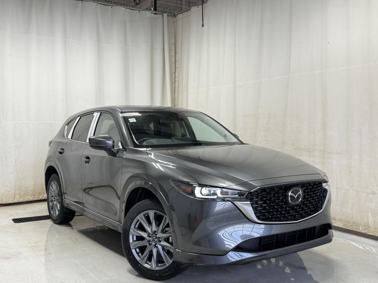 <p>NEW 2025 CX-5 GT AWD. Bluetooth, Skyactiv-G 2.5 L (Inline-4) Cylinder Deactivation. Backup Cam, Available NAV, Leather Heated/Ventilated Seats, Power Front Seats, Memory Driver Seat, Rear Heated Seats, Wireless Apple CarPlay/Android Auto, Wireless Phone Charger, Bose Premium Sound System, Advanced Keyless Remote Entry, Tilt/Sliding Moonroof, Power Trunk, Adaptive Cruise Control, Heated Steering Wheel, Wiper Blade De-Icer, Auto Dual-Zone Climate Control, Rear Air Vents, Auto Rain-Sensing Wipers, Electronic Parking Brake, Heated Mirrors, 19 Silver Metallic Alloy Wheels</p>  <p>Includes:</p> <p>i-ACTIVSENSE + Safety Features (Smart City Brake Support-Front, Cruise Traffic Support, Rear Cross Traffic Alert, Mazda Radar Cruise Control With Stop & Go, Distance Recognition Support System, Lane-Keep Assist System, Lane Departure Warning System, Advanced Blind Spot Monitoring)</p>  <p>A joy to drive, our 2025 Mazda CX-5 GT AWD radiates refined style in Machine Grey Metallic! Motivated by a 2.5 Liter 4 Cylinder that delivers 187hp tethered to a paddle-shifted 6 Speed Automatic transmission. You can put that strength to good use with the added traction of torque vectoring, and this All Wheel Drive SUV returns nearly approximately 7.8L/100km on the highway. Our CX-5 also has an expressive design with bold details like 19-inch alloy wheels, a rear roof spoiler, and bright-tipped dual exhaust outlets.</p>  <p>Our GT cabin is no ordinary interior. Its tailor-made for better travel with heated leather power front seats, a leather-wrapped steering wheel, automatic climate control, pushbutton ignition, and keyless access. Mazda makes connecting easy by providing a 10.25-inch central display, a multifunction Commander controller, Apple CarPlay/Android Auto, Bluetooth, voice control, and six-speaker audio. The versatile rear cargo space adds adventure-friendly functionality.</p>  <p>Safety is a high priority for Mazda, which helps protect you and your loved ones with automatic emergency braking, adaptive cruise control, a rearview camera, lane-keeping assistance, blind-spot monitoring, and other intelligent technologies. With all that, our CX-5 GT is here to transcend the ordinary! Save this page, Come in for a Qualified Test Drive. We Know You Will Enjoy Your Test Drive Towards Ownership!</p>  <p>Call 587-409-5859 for more info or to schedule an appointment! Listed Pricing is valid for 72 hours. Financing is available, please see dealer for term availability and interest rates. AMVIC Licensed Business.</p>