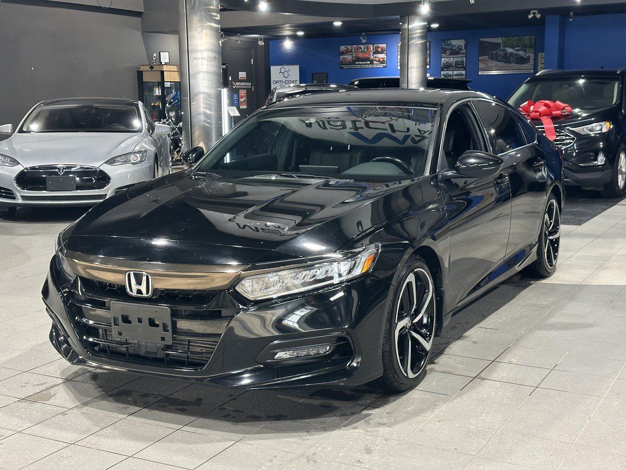 <p><strong>High Value Options</strong>:</p><ul><li>Sport Trim</li><li>Heated Seats</li><li>Sunroof</li></ul><p>The <strong>2018 Honda Accord Sport</strong> is a stylish and reliable sedan that delivers a dynamic driving experience with a perfect blend of comfort, performance, and advanced features. The Sport trim adds a sporty edge with its sleek design and enhanced performance features. Enjoy comfort year-round with heated seats, especially during colder months. The sunroof allows you to enjoy fresh air and natural light, enhancing your driving experience.</p><p>Known for its fuel efficiency, reliability, and modern technology, the 2018 Honda Accord Sport is a standout choice for drivers looking for a practical and fun-to-drive vehicle.</p><p><strong>3 Month/5000 KM Powertrain Warranty on every vehicle!</strong> 3-month warranty price is included in the advertised price. Extended warranties available (extended warranty prices not included). Every vehicle sold at Match is clean title. We do not sell ANY rebuilt vehicles. We also provide a verified CarFax report for each vehicle.</p><p>Financing available; please visit <a rel=noopener target=_new><span>www.matchautomarket.ca</span></a>.<br>Dealer permit: 4858<br>Address: 231 Oak Point Hwy</p>