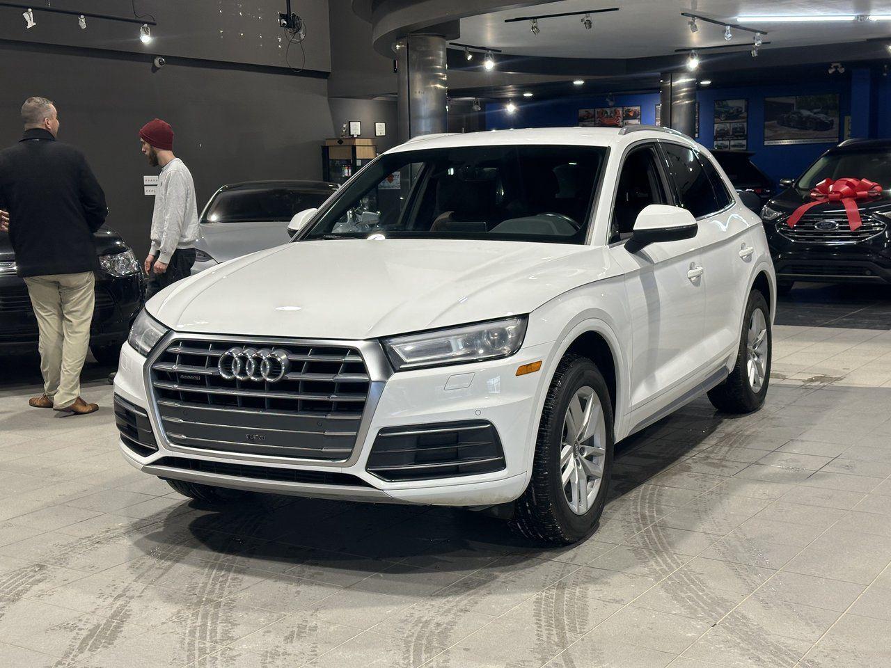 <p><strong>High Value Options:</strong></p><p>Leather<br>Navigation<br>AWD<br>Low Mileage<br>Accident Free<br>Heated Seats<br>Heated Steering Wheel</p><p>The 2018 Audi Q5 Komfort is a versatile and reliable compact SUV designed for both comfort and performance. Equipped with all-wheel drive (AWD), it ensures excellent traction and control in various road and weather conditions. The vehicle features leather seats, offering both luxury and comfort for all passengers. The advanced navigation system provides ease of travel, while the low mileage ensures the vehicle is in great condition. The Audi Q5 is also accident-free, giving you peace of mind. For added comfort, it comes with heated seats and a heated steering wheel, perfect for cold weather. Known for its reliability, style, and practicality, the Audi Q5 Komfort is an excellent choice for drivers seeking a feature-rich and capable compact SUV.</p><p><strong>3 Month/5000 KM Powertrain Warranty on every vehicle!</strong> 3-month warranty price is included in the advertised price. Extended warranties available (extended warranty prices not included).<br>Every vehicle sold at Match is clean title. We also provide a verified CarFax report for each vehicle.</p><p><strong>Financing available; please visit </strong><a rel=noopener target=_new><span><strong>www.matchautomarket.ca</strong></span></a><strong>.</strong><br>Dealer permit: 4858</p>