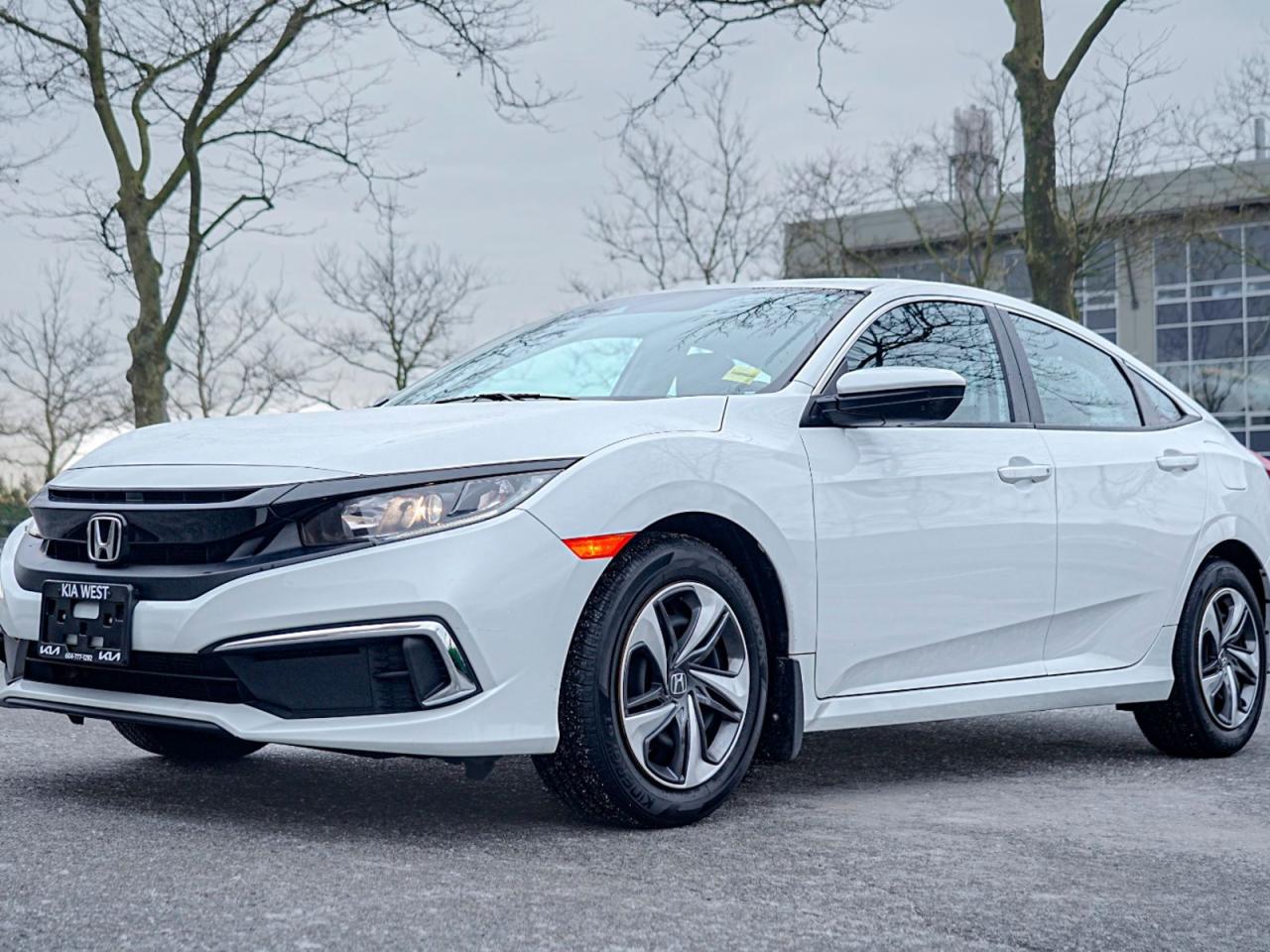 Experience Unmatched Value and Reliability with the Pre-Owned 2019 Honda Civic Sedan LX LX CVT!Get ready to elevate your daily drive with this incredible Honda Civic Sedan LX. With its sleek white exterior and elegant black interior, this Civic is the epitome of style and sophistication. Lets explore some of its remarkable features:Efficiency and Performance: Powered by a fuel-efficient 4-cylinder engine, this Civic delivers the perfect balance of power and economy. The CVT transmission ensures seamless acceleration, while the front-wheel drive offers confident handling on any road.Comfort and Convenience: Slide into the heated front seats and enjoy the climate control system that keeps the cabin at your preferred temperature. Stay in control with power windows, power door locks, and a telescopic steering wheel with audio controls at your fingertips. Modern Technology: Seamlessly connect your smartphone via Bluetooth, allowing you to make calls, stream music, and access your favorite apps without taking your hands off the wheel. The telematics system and back-up camera provide added safety and convenience.Safety at Its Best: This Civic is equipped with advanced safety features, including lane departure warning, lane-keeping assist, adaptive cruise control, automatic high beams, and front collision mitigation. With Honda Sensing, you can have peace of mind on every journey.Versatility and Space: The rear bench seat and pass-through rear seat offer ample room for passengers and cargo, ensuring everyone can ride comfortably. The cloth seats and adjustable steering wheel provide a personalized driving experience.Reliability and Confidence: Honda is renowned for its long-lasting quality and dependability. With low mileage and excellent condition, this pre-owned Honda Civic is ready to serve you for years to come.Dont miss out on this exceptional opportunity to own a pre-owned 2019 Honda Civic Sedan LX. With its unbeatable combination of style, technology, and reliability, this Civic is truly a game changer. Contact us today to schedule a test drive and make this incredible Civic yours!