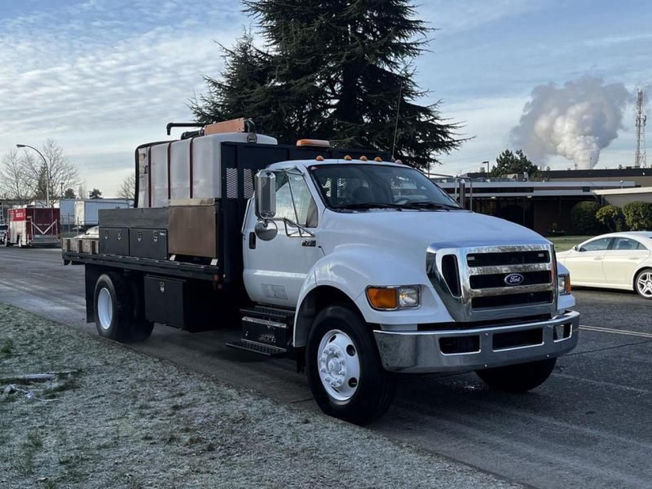 Used 2011 Ford F-750 Flat Deck 3 Seater Diesel With Air Brakes and De-icing for sale in Burnaby, BC