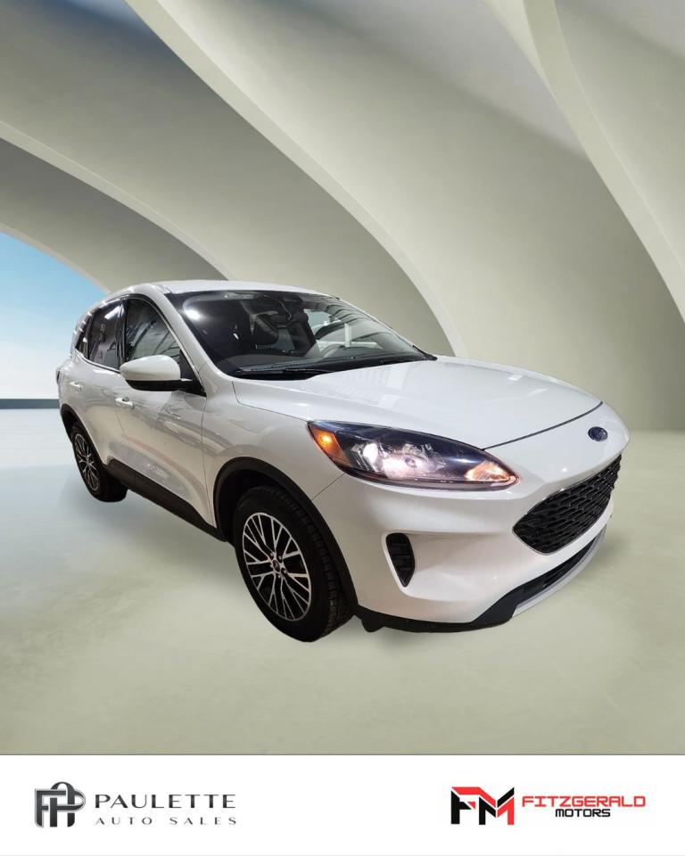 <p>Looking for a stylish and fuel-efficient SUV that wont break the bank? Look no further than this 2021 Ford Escape SE Plug-In Hybrid FWD, available now at Stephen Fitzgerald Motors. This sleek white Escape is perfect for navigating city streets or weekend adventures with its comfortable seating and powerful hybrid engine.</p><p>Enjoy the benefits of both gas and electric power, making this Escape an incredibly efficient choice. With its advanced technology and safety features, you can drive with confidence knowing you have everything you need to stay connected and secure.</p><p>Here are 5 features that are sure to impress:</p><ul><li><strong>Plug-In Hybrid Power:</strong> Experience the best of both worlds with a hybrid engine that delivers both gas and electric power for maximum fuel efficiency.</li><li><strong>Sleek and Modern Design:</strong> Turn heads with the Escapes stylish and modern design that complements any driving style.</li><li><strong>Advanced Safety Features:</strong> Drive with peace of mind thanks to features like blind spot monitoring and anti-lock brakes, ensuring youre always in control.</li><li><strong>Comfort and Convenience:</strong> Enjoy the luxurious feel of bucket seats and the convenience of keyless entry, making every drive a pleasure.</li><li><strong>Tech-Savvy Features:</strong> Stay connected and entertained with the Escapes advanced technology features, including cruise control and automatic headlights.</li></ul><p>Dont miss out on this incredible opportunity to own a 2021 Ford Escape SE Plug-In Hybrid FWD. Visit Stephen Fitzgerald Motors today for a test drive and see for yourself what this versatile SUV has to offer!</p>