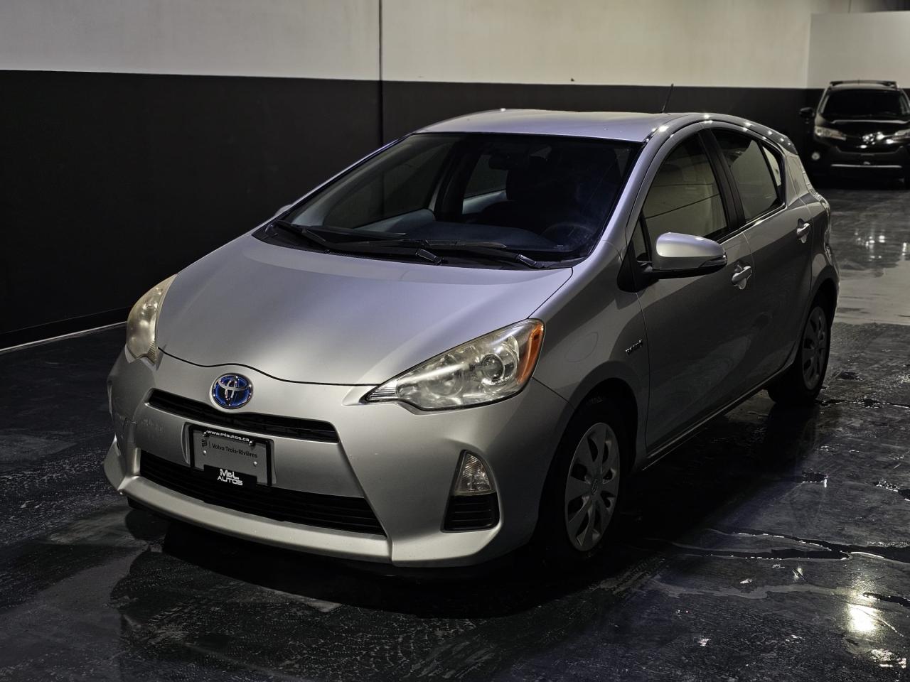 <p><strong>One-Owner 2012 Toyota Prius C Hybrid for Sale</strong><br />Available at <strong>M&L Autos</strong></p><p>******6 MONTHS POWERTRAIN WARRANTY INCLUDED******</p><p><strong>Location:</strong> 1400 Aimco Blvd Unit 19, Mississauga, ON L4W 1B2<br /><strong>Contact:</strong> 905-439-7689</p><ul><li><strong>Model:</strong> 2012 Toyota Prius C Hybrid</li><li><strong>Ownership:</strong> Single owner</li><li><strong>Engine:</strong> 1.5L Hybrid Synergy Drive for outstanding fuel efficiency</li><li><strong>Drivetrain:</strong> Front-wheel drive (FWD)</li><li><strong>Mileage:</strong> 120,500 KMS</li><li><strong>Condition:</strong> Excellent, regularly serviced, no accidents</li></ul><h3><strong>Features and Highlights:</strong></h3><ul><li><strong>Efficiency:</strong> Incredible fuel economy—ideal for city commuting and long drives, with an average of up to 53 MPG (4.4L/100 km)</li><li><strong>Technology:</strong><ul><li>Touchscreen infotainment system</li><li>Bluetooth connectivity for hands-free calls and audio streaming</li><li>USB/AUX input for added convenience</li></ul></li><li><strong>Comfort & Convenience:</strong><ul><li>Automatic climate control for year-round comfort</li><li>Spacious interior with premium fabric seats</li><li>Keyless entry and push-button start</li></ul></li><li><strong>Safety:</strong><ul><li>Backup camera for added parking ease</li><li>Stability control and ABS brakes</li><li>Multiple airbags ensuring peace of mind</li></ul></li><li><strong>Exterior:</strong><ul><li>Sleek, compact design with aerodynamic styling</li><li>Alloy wheels for a polished look</li></ul></li></ul><h3><strong>Pricing and Financing Options:</strong></h3><ul><li><strong>Price:</strong> $12,999.00 Certified + HST & Licensing</li><li><strong>Financing:</strong> Flexible financing options are available to suit your needs. Let us help you drive away in this eco-friendly vehicle today!</li></ul><p>This one-owner 2012 Toyota Prius C Hybrid is the perfect car for anyone looking to save on fuel costs while reducing their environmental impact. It’s reliable, efficient, and ready for its next owner.</p><p>Contact us today at <strong>905-439-7689</strong> to learn more or visit us at <strong>M&L Autos</strong> in Mississauga to take it for a test drive. Financing applications can also be started online or in-store.</p>