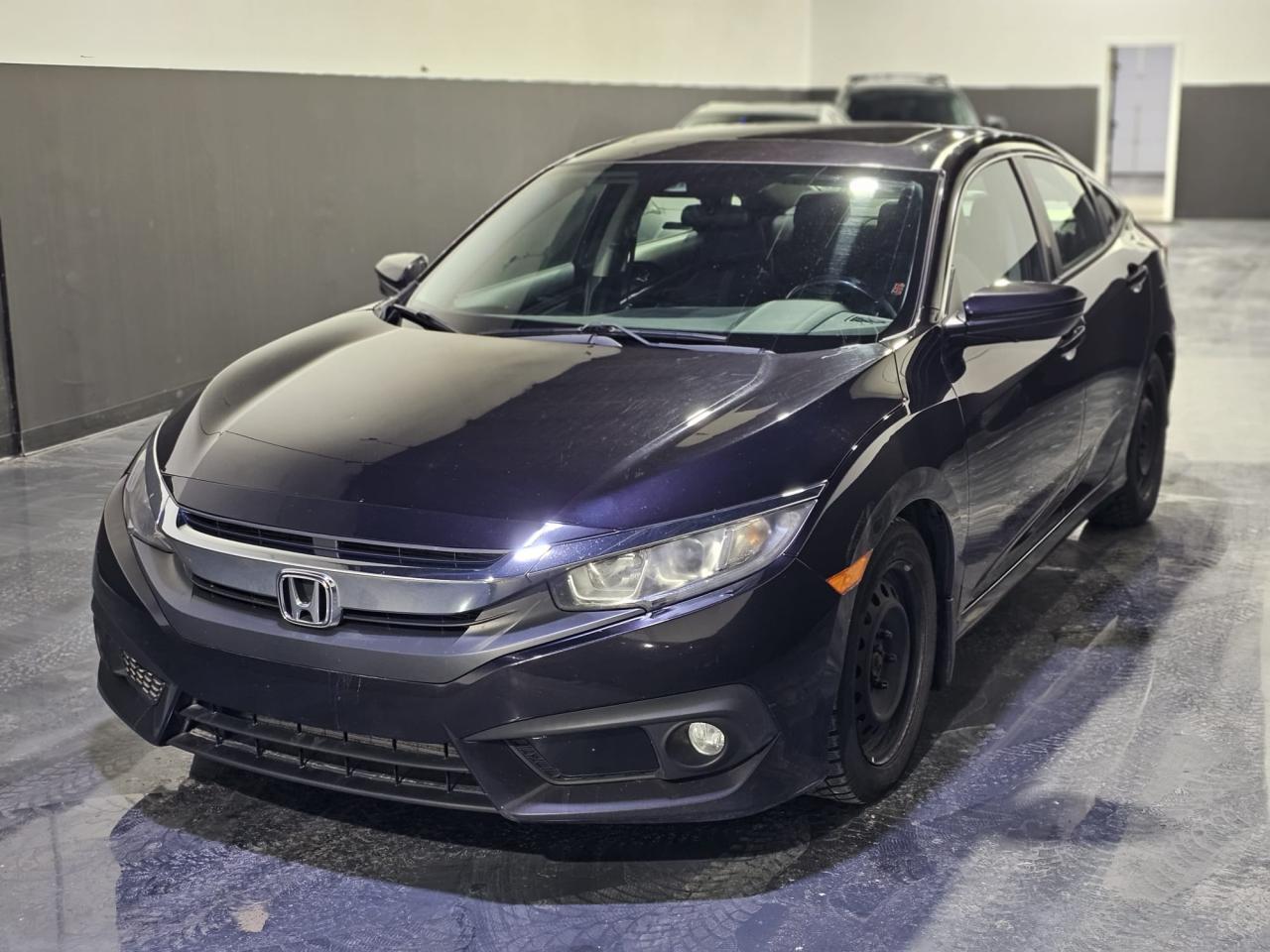 <p><strong>2016 Honda Civic EX-T – 159,101 km</strong><br />📍 <strong>Location:</strong> M&L Autos, 1400 Aimco Blvd, Unit 19, Mississauga, ON L4W 1B2<br />📞 <strong>Contact:</strong> 905-439-7689</p><p>🚗 <strong>Vehicle Details:</strong></p><ul><li><strong>Make & Model:</strong> 2016 Honda Civic EX-T</li><li><strong>Mileage:</strong> 159,101 km</li><li><strong>Engine:</strong> 1.5L Turbocharged 4-Cylinder</li><li><strong>Transmission:</strong> CVT (Continuously Variable Transmission)</li><li><strong>Drivetrain:</strong> Front-Wheel Drive (FWD)</li><li><strong>Fuel Type:</strong> Gasoline</li></ul><p>🔥 <strong>Key Features:</strong><br />✅ Sunroof / Moonroof<br />✅ Apple CarPlay & Android Auto<br />✅ Honda Sensing Safety Features<br />✅ Heated Front Seats<br />✅ Rearview Camera<br />✅ Push-Button Start & Keyless Entry<br />✅ Lane Watch Blind Spot Camera<br />✅ 17” Alloy Wheels</p><p>💰 <strong>Price:</strong> $14,999.00 Certified + HST & Licensing</p><p>📢 <strong>Why Buy from M&L Autos?</strong><br />✅ Quality Pre-Owned Vehicles<br />✅ Competitive Pricing<br />✅ Hassle-Free Financing Options Available</p><p>Come check it out today! Call or visit M&L Autos for a test drive.</p>