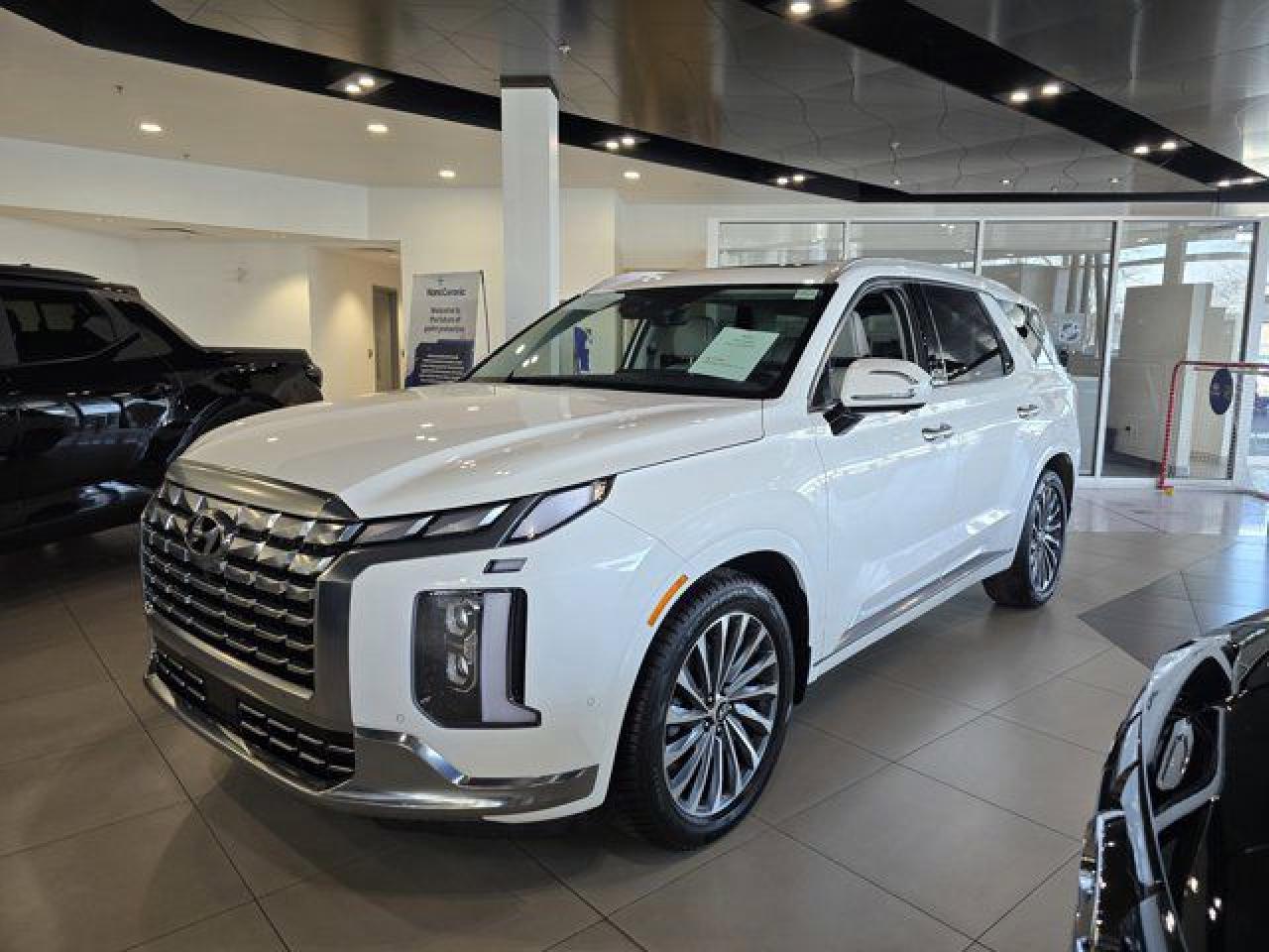 *2025 Hyundai Palisade Calligraphy AWD* Experience the pinnacle of luxury and performance with the *2025 Hyundai Palisade Calligraphy AWD*. This premium SUV is designed to deliver unparalleled comfort, advanced technology, and superior capability for any journey.    * *Key Features at a Glance*:      * *Luxurious Comfort*: Heated & Ventilated Leather Seats, Massage Seats, Tri-Zone Climate Control, and a Heated Steering Wheel ensure the ultimate driving experience.     * *Advanced Technology*: Heads-Up Display, Digital Rearview Mirror, Bluelink Remote Start & Lock, and Smart Park Assist put cutting-edge tech at your fingertips.     * *Driver Assistance*: Adaptive Cruise Control, Blind-View Monitoring, Lane Departure Assist, and Automatic Emergency Braking keep you safe and confident on the road.     * *Convenience & Versatility*: Power Folding Third Row Seats and Memory Seats make every drive more practical and tailored to your needs.     * *Performance & Capability*: All-Wheel Drive ensures exceptional handling and control in all conditions.  *Precision Hyundai Advantages* At Precision Hyundai, our *all-inclusive pricing* (just add GST) includes the Alberta Roads Package, Hood Fender & Mirror 3M, PDI, Security Registration, Tire Levy, and AMVIC Fee. No hidden fees, just transparent value. *Why Choose Precision Hyundai?* Make the Precision Decision and visit Western Canadas Best Hyundai dealership! Our team is here to help you explore all the Palisade Calligraphy has to offer. *Elevate Every Journey. The 2025 Hyundai Palisade Calligraphy AWD awaits you!*