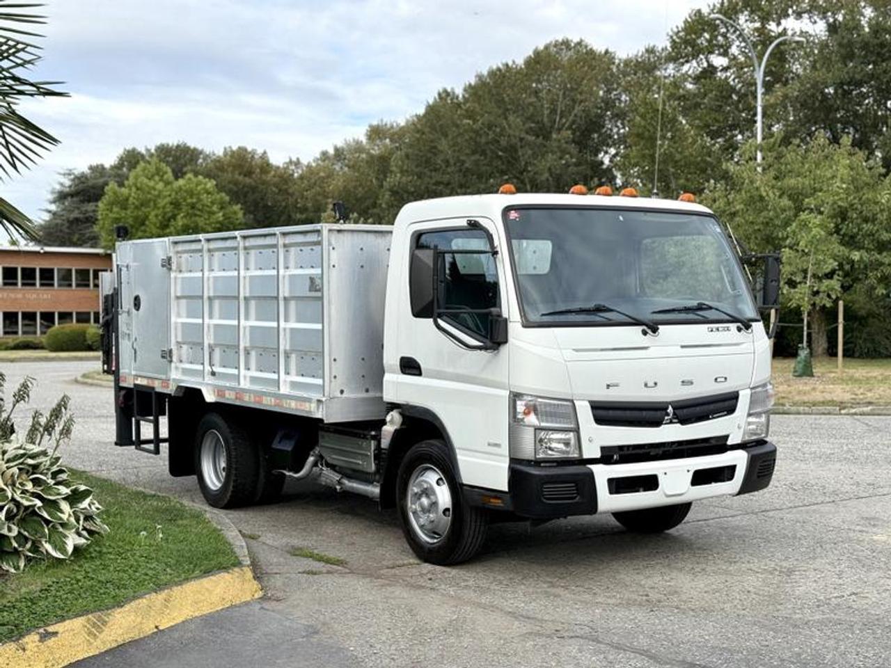 2014 Mitsubishi Fuso FE Flat Deck High Rail with Tommy Power Tailgate Diesel, 3.0L, 6 cylinder, 2 door, automatic, 4X2, cruise control, air conditioning, AM/FM radio, power door locks, power windows, white exterior, blue interior. Certification and Decal valid until January 2026.
13FT Long
7FT 8 Wide
3FT 8 High  $40,870.00 plus $375 processing fee, $41,245.00 total payment obligation before taxes.   Listing report, warranty, contract commitment cancellation fee, financing available on approved credit (some limitations and exceptions may apply). All above specifications and information is considered to be accurate but is not guaranteed and no opinion or advice is given as to whether this item should be purchased. We do not allow test drives due to theft, fraud, acts of vandalism and undetectable impaired driving. Instead we provide the following benefits: Complimentary Warranty (with options to extend), Limited Money Back Satisfaction Guarantee on Fully Completed Contracts, Contract Commitment Cancellation, and an Open-Ended Sell-Back Option. Ask seller for details or call 604-522-REPO(7376) to confirm listing availability.