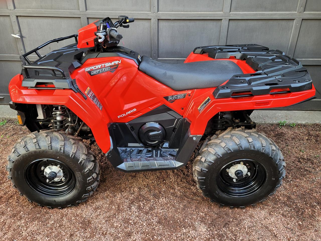 <p>Indy Red<br>One Owner, Financing Available & Trade-ins Welcome!</p><div class=n6owBd awi2gc data-sfc-cp= data-sfc-root=c data-sfc-cb= data-hveid=CAEQAA data-processed=true data-copy-service-computed-style=font-family: >The 2021 Polaris Sportsman 570 EFI is <mark class=HxTRcb data-sfc-root=c data-wiz-uids=fK5XBc_k data-sfc-cb= data-processed=true data-copy-service-computed-style=font-family: ><!--qkimaf fK5XBc_j/HugV6--><!--cqw1tb fK5XBc_j/HugV6-->a versatile, single-cylinder 567cc ATV featuring 44 HP, liquid cooling, electronic fuel injection (EFI), and On-Demand AWD/2WD<!--TgQPHd|[]--></mark>. It was heavily redesigned for 2021, featuring sharper styling, improved engine braking (EBS), a relocated battery for easier access, and a 485 lb payload capacity. Models include the Base, EPS, Premium, and trail-focused versions with improved ground clearance.</div><div class=n6owBd awi2gc data-sfc-cp= data-sfc-root=c data-sfc-cb= data-hveid=CAEQAA data-processed=true data-copy-service-computed-style=font-family: >&nbsp;<!--TgQPHd|[]--></div><div class=n6owBd awi2gc data-sfc-cp= data-sfc-root=c data-sfc-cb= data-hveid=CAIQAA data-processed=true data-copy-service-computed-style=font-family: ><strong class=Yjhzub data-sfc-root=c data-sfc-cb= data-processed=true data-copy-service-computed-style=font-family: >Key Features and Improvements:<!--TgQPHd|[]--></strong><!--TgQPHd|[]--></div><div class= data-bfc= data-ved=2ahUKEwjJu4jGsZ6UAxXPiSsGHeQnOQ8Qi4wTegQIAxAA data-processed=true data-copy-service-computed-style=font-family: ><ul class=KsbFXc U6u95 data-sfc-root=c data-sfc-cb= data-processed=true data-copy-service-computed-style=font-family: ><li class=Z1qcYe data-sfc-cp= data-sfc-root=c data-sfc-cb= data-hveid=CAMQAQ data-processed=true data-copy-service-computed-style=font-family: ><span class=T286Pc data-sfc-cp= data-sfc-root=c data-sfc-cb= data-processed=true data-copy-service-computed-style=font-family: ><strong class=Yjhzub data-sfc-root=c data-sfc-cb= data-processed=true data-copy-service-computed-style=font-family: >Performance:<!--TgQPHd|[]--></strong> 44-horsepower ProStar 4-stroke DOHC single-cylinder engine.<!--TgQPHd|[]--></span><!--TgQPHd|[]--></li><li class=Z1qcYe data-sfc-cp= data-sfc-root=c data-sfc-cb= data-hveid=CAMQAg data-processed=true data-copy-service-computed-style=font-family: ><span class=T286Pc data-sfc-cp= data-sfc-root=c data-sfc-cb= data-processed=true data-copy-service-computed-style=font-family: ><strong class=Yjhzub data-sfc-root=c data-sfc-cb= data-processed=true data-copy-service-computed-style=font-family: >Updated Design:<!--TgQPHd|[]--></strong> The 2021 model offers a redesigned front and rear, featuring a new, more aggressive look.<!--TgQPHd|[]--></span><!--TgQPHd|[]--></li><li class=Z1qcYe data-sfc-cp= data-sfc-root=c data-sfc-cb= data-hveid=CAMQAw data-processed=true data-copy-service-computed-style=font-family: ><span class=T286Pc data-sfc-cp= data-sfc-root=c data-sfc-cb= data-processed=true data-copy-service-computed-style=font-family: ><strong class=Yjhzub data-sfc-root=c data-sfc-cb= data-processed=true data-copy-service-computed-style=font-family: >Suspension:<!--TgQPHd|[]--></strong> Most models feature MacPherson Strut front suspension with 8.2 inches of travel, while the 570 Trail model offers an upgraded Arched Double A-Arm front suspension with 9.5 inches of travel.<!--TgQPHd|[]--></span><!--TgQPHd|[]--></li><li class=Z1qcYe data-sfc-cp= data-sfc-root=c data-sfc-cb= data-hveid=CAMQBA data-processed=true data-copy-service-computed-style=font-family: ><span class=T286Pc data-sfc-cp= data-sfc-root=c data-sfc-cb= data-processed=true data-copy-service-computed-style=font-family: ><strong class=Yjhzub data-sfc-root=c data-sfc-cb= data-processed=true data-copy-service-computed-style=font-family: >Handling & Capacity:<!--TgQPHd|[]--></strong> 11.5 inches of ground clearance, 1,350 lb towing capacity, and 90 lb/180 lb front/rear rack capacity.<!--TgQPHd|[]--></span><!--TgQPHd|[]--></li><li class=Z1qcYe data-sfc-cp= data-sfc-root=c data-sfc-cb= data-hveid=CAMQBQ data-processed=true data-copy-service-computed-style=font-family: ><span class=T286Pc data-sfc-cp= data-sfc-root=c data-sfc-cb= data-processed=true data-copy-service-computed-style=font-family: ><strong class=Yjhzub data-sfc-root=c data-sfc-cb= data-processed=true data-copy-service-computed-style=font-family: >Accessibility:<!--TgQPHd|[]--></strong> The battery was moved to beneath the front rack, making it easier to access.<!--TgQPHd|[]--></span><!--TgQPHd|[]--></li><li class=Z1qcYe data-sfc-cp= data-sfc-root=c data-sfc-cb= data-hveid=CAMQBg data-processed=true data-copy-service-computed-style=font-family: ><span class=T286Pc data-sfc-cp= data-sfc-root=c data-sfc-cb= data-processed=true data-copy-service-computed-style=font-family: ><strong class=Yjhzub data-sfc-root=c data-sfc-cb= data-processed=true data-copy-service-computed-style=font-family: >Lighting:<!--TgQPHd|[]--></strong> The 2021 models include new, improved LED lights (on higher trim levels)</span></li></ul></div><p>&nbsp;</p>