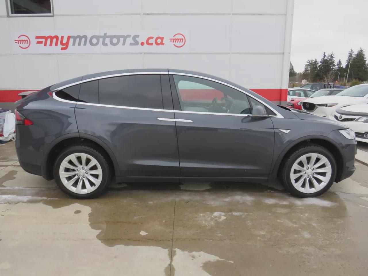 2016 Tesla Model X 90D (**AWD**FALCON WING REAR DOORS**ALLOY RIMS**FOG LIGHTS**LEATHER**NAVIGATION**POWER SEATS**POWER DOORS**17 INCH TOUCHSCREEN DISPLAY**HEATED SEATS**HEATED STEERING WHEEL**REVERSE CAMERA**BLUETOOTH**CRUISE CONTROL**) Photo