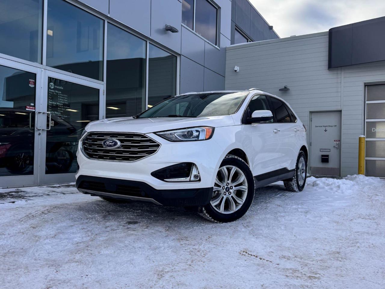 Our inviting 2019 Ford Edge Titanium is shown off in White Platinum Metallic Tri-Coat! Its powered by a Turbocharged 2.0 Liter 4 Cylinder engine that produces 245 horsepower while paired with a 8-Speed automatic transmission.Its absolutely stunning with alloy wheels, dual exhaust, LED headlights, and rear roof spoiler.Inside our Titanium, open the door to find a world of comfort and convenience! Settle into black leather seating, grip the leather-wrapped steering wheel with mounted audio/cruise controls and look over to see the color navigation. Its also equipped with driver memory settings, dual-zone climate control, front heated seats, an AM/FM radio thats XM radio ready, an impressive 6 speaker sound system, and a power liftgate.Our Ford will give you peace of mind with its wide variety of safety features including a backup camera, a blind spot/lane departure warning system, daytime running lights, dusk sensing headlights, stability/traction control, an immense amount of airbags and more!Print this page and call us Now... We Know You Will Enjoy Your Test Drive Towards Ownership! We look forward to showing you why Go Mazda is the best place for all your automotive needs.Go Mazda is an AMVIC licensed business.Please note: this vehicle is showing a CarFax incident in the amount of $1,642.00