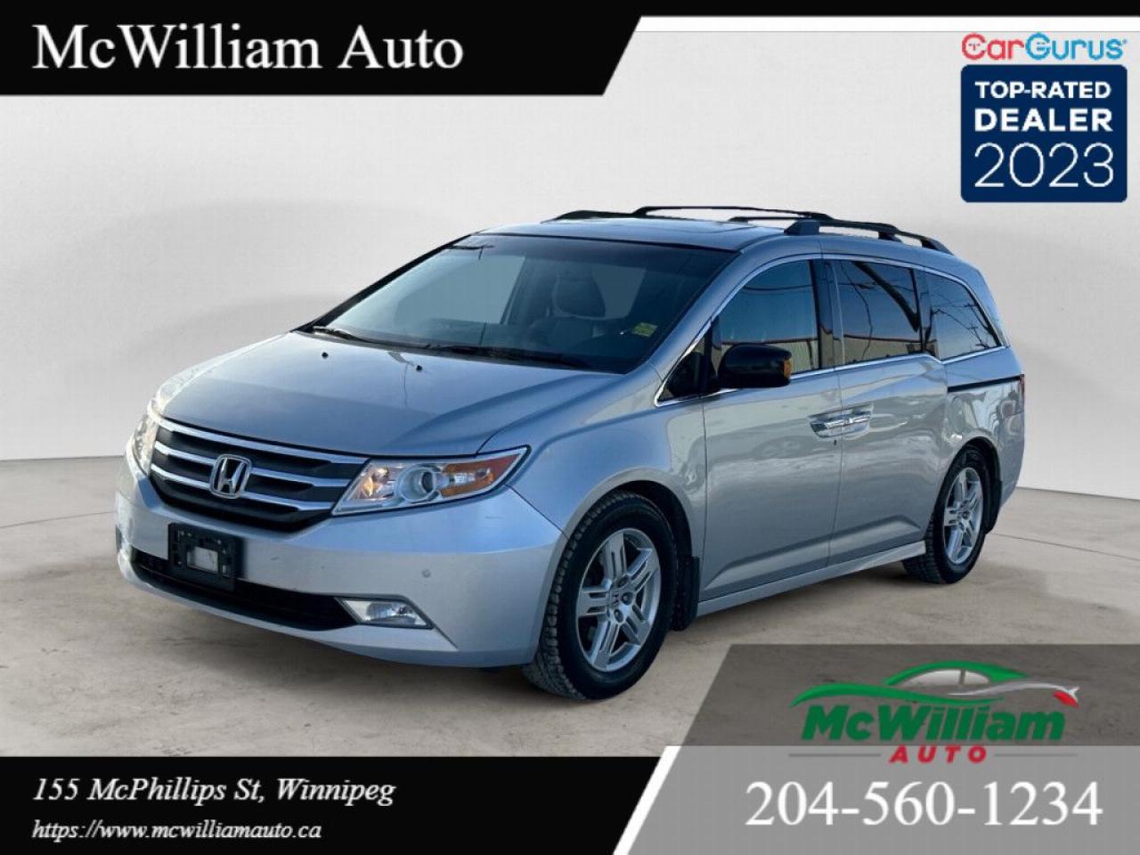 <br> 2013 Honda Odyssey Touring Elite Fully Loaded!<br><br> LOWEST PRICES IN THE CITY WE PRICE MATCH! <br><br>Visit Us:<br> 155 McPhillips Street, Winnipeg, MB<br> (204) 560-1234<br><br>Exterior: Silver<br>Interior: Beige/Tan Leather<br><br>This 2013 Honda Odyssey Touring Elite is the ultimate family van, packed with premium features and legendary Honda reliability. With only 144,000 km, this local Manitoba vehicle is ready for your next adventure!<br><br>Key Features:<br> 3.5L V6 Engine Powerful, efficient, and reliable.<br> Seats 8 Spacious and perfect for families.<br> Leather Interior Heated front seats, sunroof, and DVD player.<br> Tech & Convenience Backup camera, GPS navigation, power sliding doors, and more.<br> Safety Features Vehicle Stability Assist, anti-lock brakes, and multiple airbags.<br><br>Why Choose Us?<br> Bad Credit? 100% approval rate!<br> Large Inventory Over 100 vehicles in stock.<br> Canada-Wide Delivery Well bring your vehicle to you!<br><br>Visit Us Today!<br> 155 McPhillips Street, Winnipeg, MB<br> (204) 560-1234<br><br>