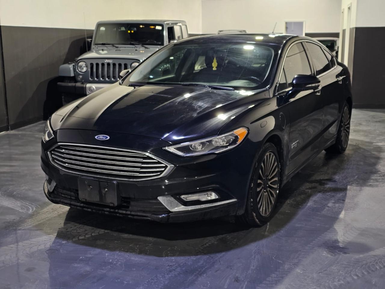 <h3><strong>2017 Ford Fusion Hybrid SE Luxury – Fuel Efficiency & Comfort Combined!</strong></h3><p>🚗 <strong>M&L Autos</strong> – Your Trusted Auto Dealer in Mississauga!</p><p>🔹 <strong>Year:</strong> 2017<br />🔹 <strong>Make & Model:</strong> Ford Fusion Hybrid SE Luxury<br />🔹 <strong>Engine:</strong> 2.0L 4-Cylinder Hybrid<br />🔹 <strong>Transmission:</strong> CVT (Continuously Variable Transmission)<br />🔹 <strong>Fuel Type:</strong> Hybrid (Gas/Electric)<br />🔹 <strong>Mileage:</strong> 175,500 kms<br />🔹 <strong>Exterior Color:</strong> Black<br />🔹 <strong>Interior:</strong> Premium Leather Seats</p><h3><strong>Features & Highlights:</strong></h3><p>✅ <strong>Fuel Efficiency:</strong> Enjoy outstanding fuel economy with hybrid technology<br />✅ <strong>Comfort & Luxury:</strong> Leather-trimmed seats, power-adjustable driver’s seat<br />✅ <strong>Infotainment & Tech:</strong> SYNC 3 with touchscreen, Apple CarPlay & Android Auto<br />✅ <strong>Safety First:</strong> Blind-spot monitoring, rearview camera, lane-keeping assist<br />✅ <strong>Smooth Drive:</strong> Eco-friendly performance with a quiet and comfortable ride<br />✅ <strong>Spacious & Practical:</strong> Ample legroom, large trunk space</p><p>💰 <strong>Price:</strong> $11,999.00 – Financing Available!</p><p>📍 <strong>Visit Us:</strong> M&L Autos, 1400 Aimco Blvd, Unit 19, Mississauga, ON L4W 1B2<br />📞 <strong>Call/Text:</strong> 905-439-7689</p><p>🚀 <strong>Test Drive Today!</strong> Experience the perfect blend of efficiency, style, and comfort.</p>