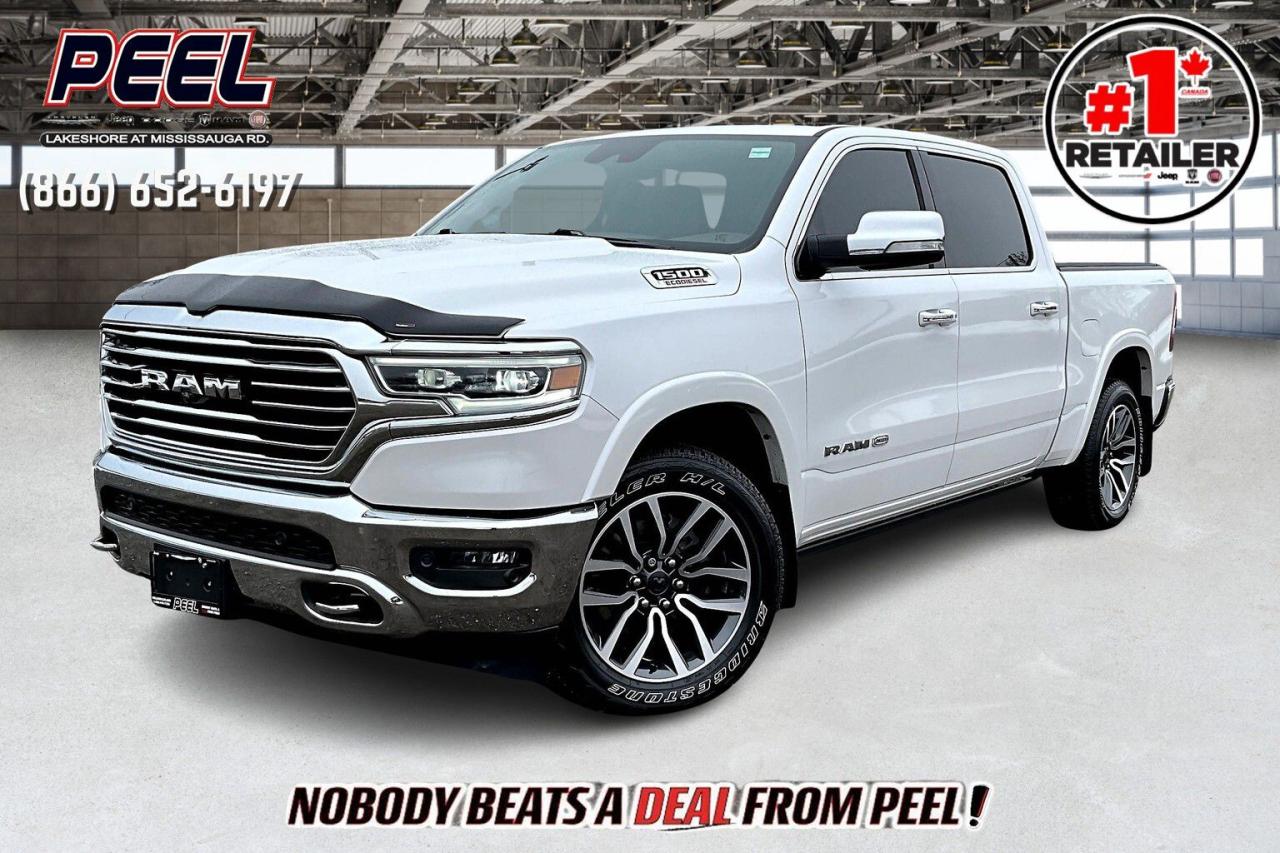 COME SEE WHY NOBODY BEATS A DEAL FROM PEEL! Your Source for ALL make and models used cars and trucks. Canadas #1 Stellantis Retailer for 9 years & counting!!

2020 Ram 1500 Longhorn Crew Cab 4X4 | 3.0L Ecodiesel V6 | Ivory Tri-coat Pearl | LOADED | Heated & Ventilated Leather Bucket Seats | Uconnect 12" Touchscreen Display w/ Navigation | 19-speaker Harman/Kardon High Performance Audio System | Advanced Safety Group | Longhorn Level 1 Equipment Group | Power Running Boards | Wireless Smartphone Charging Pad | Apple CarPlay & Android Auto | Heated Steering Wheel | Remote Start | Adaptive Cruise Control | Lane Keep Assist | Forward Collision Warning | Blind Spot Monitoring | Parallel & Perpendicular Park Assist | Bed Utility Group | Active-Level 4-Corner Air Suspension | Park-sense Front & Rear Parking Sensors | Remote Proximity Keyless Entry | Class IV Hitch Receiver | Trailer Brake Control | Deployable Bed Step

One Owner Clean Carfax

Includes Retrax Retractable Hard Tonneau Cover with Cross Bars - $6,000+ Set up

A rare combination of luxury, power, and fuel efficiency, this 2020 Ram 1500 Longhorn Crew Cab 4X4 is a fully loaded premium truck designed for those who demand the best. Under the hood, the 3.0L EcoDiesel V6 delivers outstanding torque and fuel economy, perfect for long hauls or heavy towing, enhanced by the Class IV Hitch Receiver, Trailer Brake Control, and Active-Level 4-Corner Air Suspension for a smooth, controlled ride. Finished in Ivory Tri-Coat Pearl, it exudes refinement, complemented by Power Running Boards and the Longhorn Level 1 Equipment Group for next-level convenience. Inside, the Heated & Ventilated Leather Bucket Seats, Heated Steering Wheel, and Wireless Charging Pad provide first-class comfort, while the Uconnect 12 Touchscreen with Navigation, Apple CarPlay & Android Auto, and a 19-Speaker Harman/Kardon Audio System create an immersive driving experience. The Advanced Safety Group includes Adaptive Cruise Control, Lane Keep Assist, Forward Collision Warning, Blind Spot Monitoring, and Parallel & Perpendicular Park Assist, ensuring maximum confidence behind the wheel. The Bed Utility Group with a Deployable Bed Step, Spray-In Bed Liner, and Park-Sense Front & Rear Parking Sensors adds durability and practicality. With a One Owner Clean Carfax, this Longhorn EcoDiesel is the perfect blend of high-end luxury, rugged capability, and best-in-class efficiency - dont miss out on this elite truck!
______________________________________________________

Engage & Explore with Peel Chrysler: Whether youre inquiring about our latest offers or seeking guidance, 1-866-652-6197 connects you directly. Dive deeper online or connect with our team to navigate your automotive journey seamlessly.

WE TAKE ALL TRADES & CREDIT. WE SHIP ANYWHERE IN CANADA! OUR TEAM IS READY TO SERVE YOU 7 DAYS!
______________________________________________________
Our advertised prices are for consumers (i.e end users) only. 

*FREE CarFax (click the link above to check it out at no cost to you!)*

*FULLY CERTIFIED! (Have you seen some of these other dealers stating in their advertisements that certification is an additional fee? NOT HERE! Our certification is already included in our low sale prices to save you more!)

______________________________________________________

Peel Chrysler  A Trusted Destination: Based in Port Credit, Ontario, we proudly serve customers from all corners of Ontario and Canada including Toronto, Oakville, North York, Richmond Hill, Ajax, Hamilton, Niagara Falls, Brampton, Thornhill, Scarborough, Vaughan, London, Windsor, Cambridge, Kitchener, Waterloo, Brantford, Sarnia, Pickering, Huntsville, Milton, Woodbridge, Maple, Aurora, Newmarket, Orangeville, Georgetown, Stouffville, Markham, North Bay, Sudbury, Barrie, Sault Ste. Marie, Parry Sound, Bracebridge, Gravenhurst, Oshawa, Ajax, Kingston, Innisfil and surrounding areas. On our website www.peelchrysler.com, you will find a vast selection of new vehicles including the new and used Ram 1500, 2500 and 3500. Chrysler Grand Caravan, Chrysler Pacifica, Jeep Cherokee, Wrangler and more. All vehicles are priced to sell. We deliver throughout Canada. website or call us 1-866-652-6197. 

Disclaimer Statement: At Peel Chrysler, your satisfaction is our priority. While many pre-owned vehicles originally come with two keys, variations may occur based on trade-ins, and all Peel Chrysler Pre-Owned Vehicles come standard with one keyany extras provided by the previous owner will be included with your purchase, and additional keys can be bought at the time of sale. Online prices and payments are for finance purchases. Used vehicles that are being financed are subject to a $499 (^$1500 non-prime) financing fee, while cash purchases (certified cheque, bank draft, or wire transfer) on used vehicles have a $2,000 surcharge ( online price + $2,000). Cash purchases of new vehicles only incur applicable taxes and licensing fees, and those priced above $100,000 (including accessories or add-ons) are subject to a federal luxury tax. Optional finance and lease terms are available, and if trading in a vehicle with an outstanding loan balance requiring Peel Chrysler to facilitate the lien payout, a Lien Payout Fee of $349 applies. Prices, rates, and payments are subject to change without notice. While we strive for accuracy, occasional technical or human errors may occur, so we encourage verifying all vehicle details, including features, options, materials, and specifications, with a Peel Chrysler representative by contacting us or visiting our dealership. Experience seamless convenience with our nationwide delivery optionsvisit our website or contact us for more details.