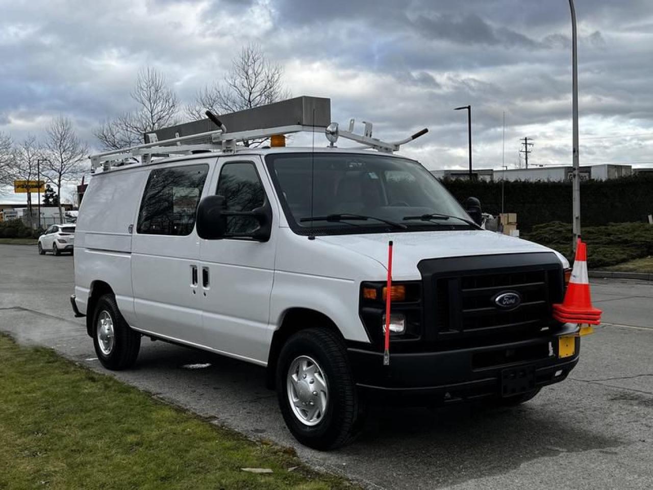 Used 2011 Ford Econoline E-350 Cargo Van With Rear Shelving And Ladder Rack for sale in Burnaby, BC