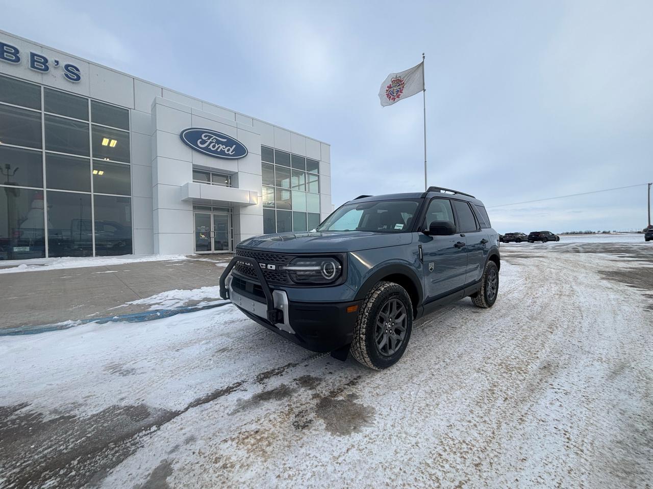 <p>Get ready to conquer any terrain with this brand new 2025 Ford Bronco Sport Big Bend 4x4, available now at Webbs 1441! This rugged and stylish SUV is ready to take on your next adventure, whether its a weekend getaway or a daily commute. The Azure Grey Metallic Tri-Coat exterior is sure to turn heads, while the Black Diamond Off Road Package adds a touch of toughness.</p><p>&nbsp;</p><p>Step inside and enjoy the comfort of the cloth seats with easy-clean material, perfect for those spontaneous adventures. The 1.5L EcoBoost engine provides plenty of power, while the 8-speed automatic transmission ensures smooth shifting.</p><p>&nbsp;</p><p>Here are five features that will make you want to get behind the wheel of this Bronco Sport:</p><p><br /><br /></p><ul><ul><li><strong>Azure Grey Metallic Tri-Coat:</strong> This stunning exterior color is sure to make a statement wherever you go.</li></ul></ul><p>&nbsp;</p><ul><ul><li><strong>Black Diamond Off Road Package:</strong> This package includes features like off-road tires, skid plates, and a rear differential locker, making this Bronco Sport ready for anything.</li></ul></ul><p>&nbsp;</p><ul><ul><li><strong>1.5L EcoBoost Engine:</strong> This powerful engine delivers plenty of torque for confident acceleration and passing.</li></ul></ul><p>&nbsp;</p><ul><ul><li><strong>8-Speed Automatic Transmission:</strong> This smooth-shifting transmission provides a comfortable and efficient driving experience.</li></ul></ul><p>&nbsp;</p><ul><ul><li><strong>Cargo Management System:</strong> Keep your gear organized and secure with this handy feature.</li></ul></ul><p><br /><br /></p><p>Visit Webbs 1441 today to experience the thrill of driving this new Ford Bronco Sport Big Bend 4x4.</p><p>&nbsp;</p><p><em>Powered by AutoIntelligence&trade; AI</em></p><p>&nbsp;</p>