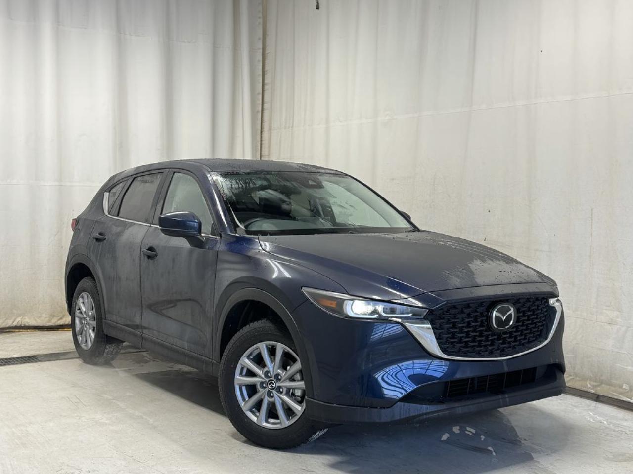 <p>NEW 2025 CX-5 GX AWD. Bluetooth, Skyactiv-G 2.5 L (Inline-4). Backup Cam, Available NAV, Cloth Heated Seats, Adaptive Cruise Control, Auto Rain-Sensing Wipers, Touchscreen Centre Display For Apple CarPlay & Android Auto, Electronic Parking Brake, Heated Mirrors, 17 Silver Metallic Alloy Wheels, Type C USB</p>  <p>Includes:</p> <p>(3m h.f.m 18 + awm + cargo tray and a full protection package - UNDERCOAT, PAINT SEALANT, RUST INHIBITOR AND INTERIOR PROTECTION)</p> <p>i-ACTIVSENSE + Safety Features (Smart City Brake Support-Front, Day/Night Forward Pedestrian Detection, Rear Cross Traffic Alert, Mazda Radar Cruise Control With Stop & Go, Distance Recognition Support System, Lane-Keep Assist System, Lane Departure Warning System, Advanced Blind Spot Monitoring)</p>  <p>Our sophisticated 2025 Mazda CX-5 GX AWD is a detailed example of dynamic driving in Deep Crystal Blue Mica! Powered by a 2.5 Liter 4 Cylinder that generates 187hp tethered to a 6 Speed Automatic transmission for responsive acceleration. Standard torque vectoring helps you take on the turns with athletic confidence, and this All Wheel Drive SUV also returns nearly approximately 7.8L/100km on the highway. Exquisitely sculpted, our CX-5 looks sensation with LED lighting, a rear roof spoiler, bright-tipped dual exhaust outlets, rain-sensing wipers, and bold alloy wheels.</p>  <p>A sense of high-end style radiates throughout our GX cabin, which provides comfortable cloth seats, a leather-wrapped steering wheel, filtered air conditioning, pushbutton ignition, and rewarding features for connected driving. A 10.25-inch central display is the starting point and supports a multifunction Commander control, Apple CarPlay/Android Auto, Bluetooth, voice control, and a four-speaker sound system. Theres plenty of clever storage, too!</p>  <p>Mazda promotes safer adventures with advanced driver assistance from a rearview camera, automatic emergency braking, adaptive cruise control, lane-keeping assistance, blind-spot monitoring, and more. With all that, our CX-5 GX is here to transcend the ordinary! Save this page, Come in for a Qualified Test Drive. We Know You Will Enjoy Your Test Drive Towards Ownership!</p>  <p>Call 587-409-5859 for more info or to schedule an appointment! Listed Pricing is valid for 72 hours. Financing is available, please see dealer for term availability and interest rates. AMVIC Licensed Business.</p>
