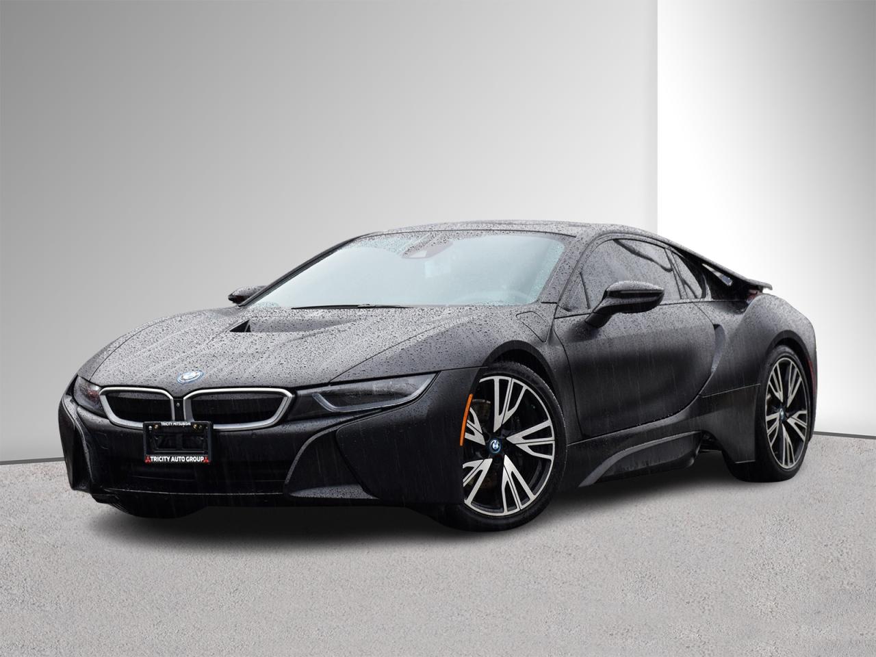 2017 BMW i8 Protonic Edition  A Batmobile for the Real World. Cloaked in its head-turning Frozen Black Metallic paint, the 2017 BMW i8 Coupe looks like it roared straight out of Gotham City. With sculpted lines, scissor doors, and a stance that commands every road, this hybrid marvel blends superhero aesthetics with cutting-edge engineering and features like- Carbon-fiber reinforced plastic body and aluminum chassis, Swing-wing doors, HEADS UP DISPLAY, 20 wheels, LED headlights, tinted windows, heated seats, dual-zone climate control, a navigation system and many more.

This i8 wasnt just boughtit was earned. When a Saskatchewan turned Victoria summer homeowner listed his prized Protonic Edition, we jumped. But there was a twist, he wanted a Toyota Tundra TRD Pro in exchange. Luckily, wed just acquired a near-new Tundra TRD Pro that matched his dream specs. Within hours, a deal was struck and this meticulously cared for and low mileage i8 became ours and now, it could be Yours. This Batmobile-esque beauty isnt parked at just any dealership, its waiting Exclusively at Tricity Mitsubishi.

CarFax report and Safety inspection available for review. Large used car inventory! Open 7 days a week! IN HOUSE FINANCING available. Close to 100% approval rate. We accept all local and out of town trade-ins.    For additional vehicle information or to schedule your appointment, call us or send an inquiry.   Pricing is subject to $995 doc fee and prep fee starting at $195.  We also specialize in out of town deliveries. This vehicle may be located at one of our other lots, please call to book an appointment to ensure the vehicle is available.