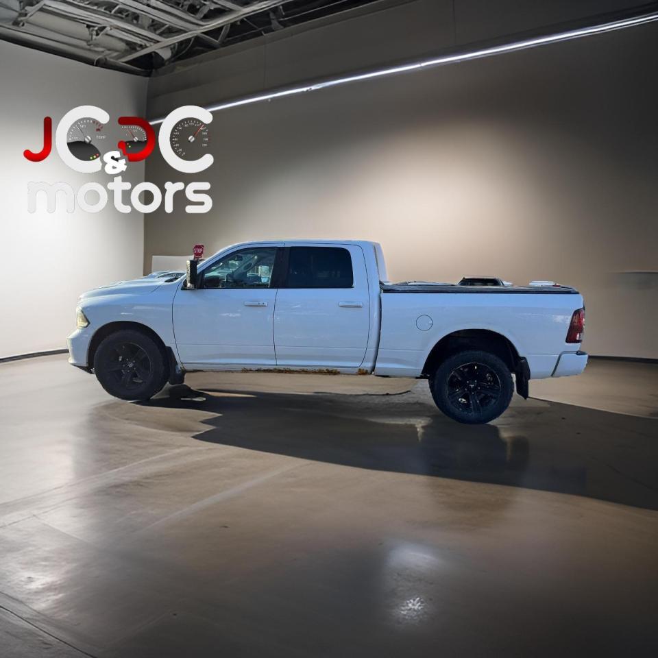 2014 RAM 1500 4WD CREW CAB 149" SPORT - Photo #4