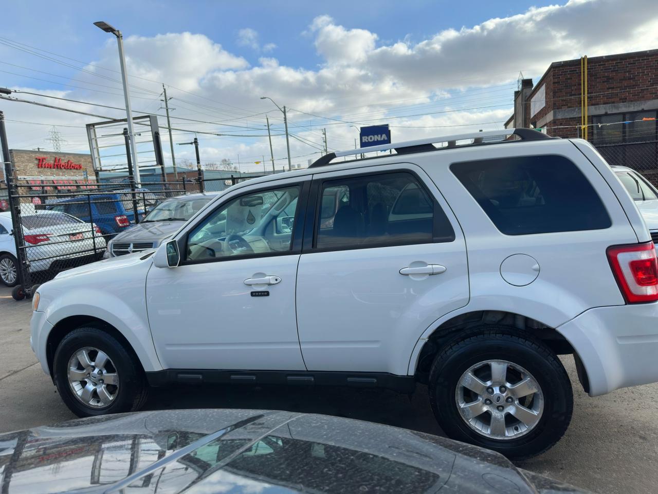 2010 Ford Escape 4WD 4dr V6 Auto Limited Photo2