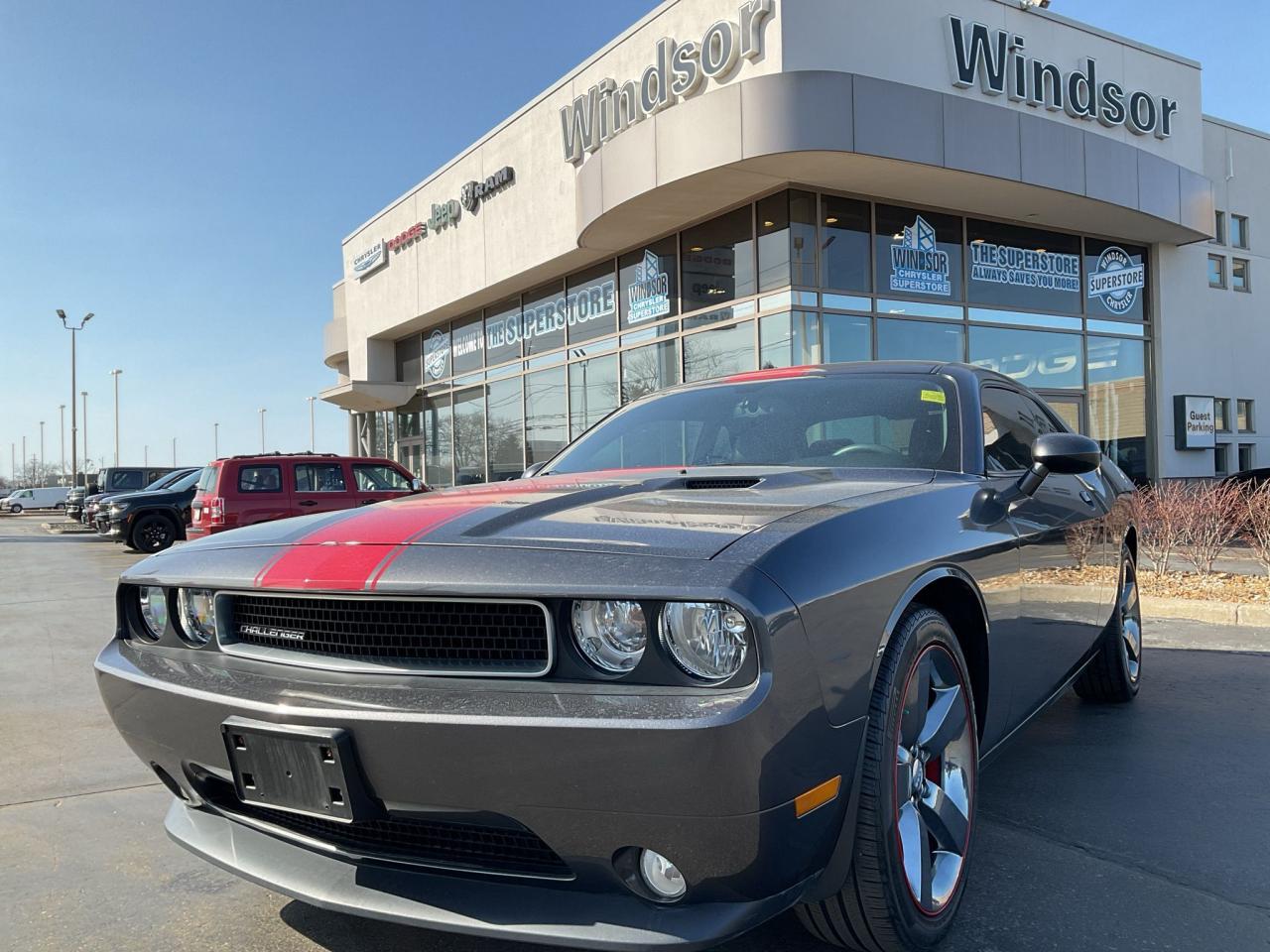 Odometer is 53519 kilometers below market average! Recent Arrival!Granite Crystal Metallic Clearcoat 2014 Dodge Challenger Rallye Redline RWD 5-Speed Automatic 3.6L V6 VVT**CARPROOF CERTIFIED**.* PLEASE SEE OUR MAIN WEBSITE FOR MORE PICTURES AND CARFAX REPORTS * Buy in confidence at WINDSOR CHRYSLER with our 95-point safety inspection by our certified technicians. Searching for your upgrade has never been easier. You will immediately get the low market price based on our market research, which means no more wasted time shopping around for the best price, Its time to drive home the most car for your money today. OVER 100 Pre-Owned Vehicles in Stock! Our Finance Team will secure the Best Interest Rate from one of out 20 Auto Financing Lenders that can get you APPROVED! Financing Available For All Credit Types! Whether you have Great Credit, No Credit, Slow Credit, Bad Credit, Been Bankrupt, On Disability, Or on a Pension, we have options. Looking to just sell your vehicle? We buy all makes and models let us buy your vehicle. Proudly Serving Windsor, Essex, Leamington, Kingsville, Belle River, LaSalle, Amherstburg, Tecumseh, Lakeshore, Strathroy, Stratford, Leamington, Tilbury, Essex, St. Thomas, Waterloo, Wallaceburg, St. Clair Beach, Puce, Riverside, London, Chatham, Kitchener, Guelph, Goderich, Brantford, St. Catherines, Milton, Mississauga, Toronto, Hamilton, Oakville, Barrie, Scarborough, and the GTA.