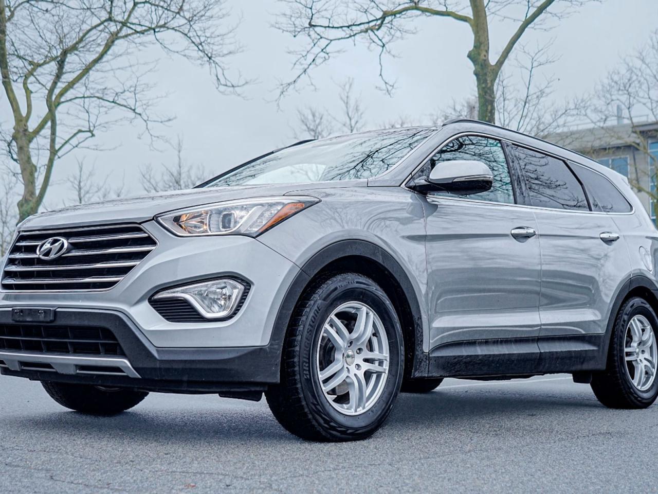 Elevate your driving experience with this stunning pre-owned 2015 Hyundai Santa Fe XL Limited AWD! With a sleek Grey exterior and luxurious Black interior, this vehicle is packed with premium features to enhance your comfort and convenience on every journey.Experience top-of-the-line amenities such as automatic headlights, panoramic roof, heated front and rear seats, leather seats, ventilated front seats, heated steering wheel, and a hands-free liftgate. Stay connected and entertained with satellite radio, Bluetooth connection, and a premium sound system.Drive with confidence thanks to advanced safety features including a blind spot monitor, rear backup camera, stability control, ABS, and multiple airbags for your peace of mind. Equipped with a V6 Cylinder Engine and All Wheel Drive capability, this Santa Fe XL delivers power and performance in equal measure.Dont miss out on the opportunity to own this luxurious and feature-packed SUV. Contact us today to schedule a test drive and make this dream SUV a reality in your life!