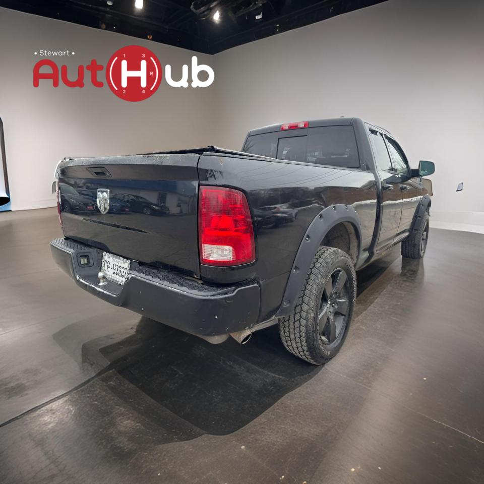 2011 RAM 1500 4WD Quad Cab 140.5" SLT - Photo #7