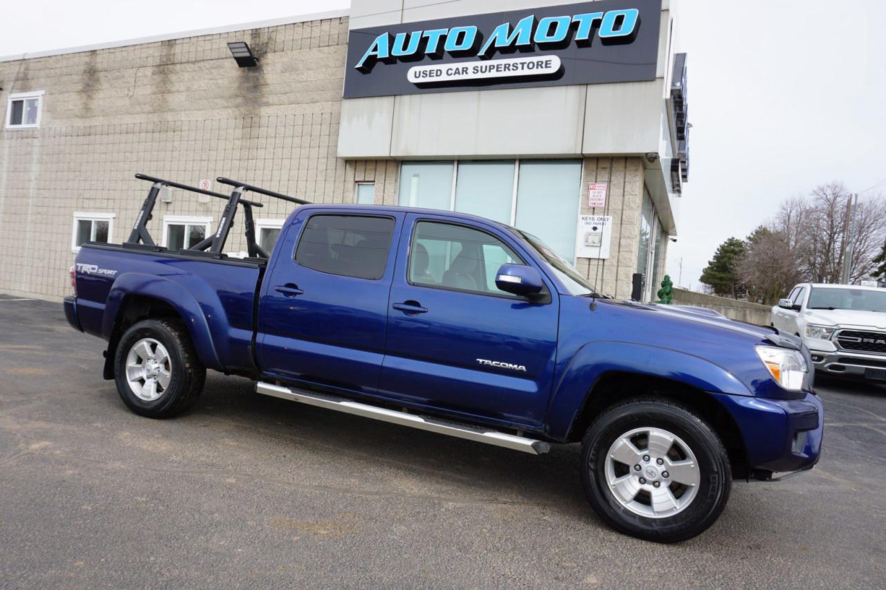 <div>*SAFETY INCLUDED*V6 CREW TRD-SPORT<span>*V6 TRD LONG BED </span><span>*</span><span>4x4* Very Clean Toyota Tacoma </span><span>with Automatic Transmission has Back Up Camera, Alloys and Cruise Control. Blue on Tan Interior: Power Windows, Power Locks, and Power Mirrors, CD/AUX, AC, Keyless, Bluetooth, Cruise Control, Tow Hitch, Alloys, Direction Compass, Back Up Camera, Bluetooth, Heated Seats, Fog Lights, Steering Mounted Controls, Tow Hitch, Bed Liner,</span><span> and ALL THE POWER OPTIONS!! </span></div><br /><div><span>-------------------------------------------------</span><br><span>Financing options are available start from 6.96% with $0 Down payment O.A.C.</span><br><span>-------------------------------------------------</span><br><span>SAFETY CERTIFICATION INCLUDED*** Vehicle comes with: Safety Certification, and Car Fax Report ALL INCLUDED!! At no extra cost to you!! Dont miss this opportunity to own a high-quality, pre-owned vehicle. </span><br><span>-------------------------------------------------</span><br><span>Additionally, our vehicles qualify for up to 4 years of extended warranty. Please speak to your sales representative for more information.</span><br><span>-------------------------------------------------</span><br><span>We are open Monday to Saturday from 10am - 6pm, Sundays Closed.</span><br><span>-------------------------------------------------</span><br><span>We also welcome trade-ins, with on-site buyers available to estimate your vehicle on the same day.</span><br><span>-------------------------------------------------</span><br><span>Visit us at 3219 Harvester Road, Burlington, L7N 3N8 or call us at Nine O Five-281-2255 for more information.</span><br><span>------------------------------------------------</span><br><span>Check our inventory at www automotoinc ca</span></div>