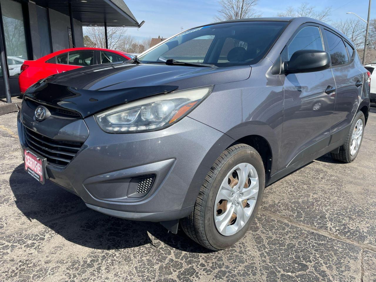 <p>CERTIFIED WITH 2 YEAR WARRANTY INCLUDED!!!</p><p>WE FINANCE EVERYONE REGARDLESS OF CREDIT !!!</p><p>VOTED BRANTFORDS BEST USED CAR DEALER 2024 !!!!</p><p>Get ready to explore the great outdoors in style with this sleek and reliable 2014 Hyundai Tucson AWD. This grey SUV/crossover is a perfect blend of comfort and capability, with its spacious interior and dependable all-wheel drive system. The Tucson features a 4-cylinder engine paired with an automatic transmission for smooth and efficient performance, whether youre navigating city streets or tackling winding country roads.</p><p>With only 120,000km on the odometer, this Tucson is just getting started. Its well-maintained condition is evident in its clean interior, complete with comfortable bucket seats and a CD player for your entertainment.</p><p>Ready to experience the convenience and versatility of the Hyundai Tucson? Come visit us at Right Choice Auto, your trusted source for quality pre-owned vehicles. Were confident youll find this Tucson is the perfect fit for your next adventure.</p><p><strong>Here are 5 features that are sure to turn heads:</strong></p><ul><li><strong>All-Wheel Drive:</strong> Conquer any terrain with confidence, thanks to the Tucsons reliable all-wheel drive system.</li><li><strong>Heated Mirrors:</strong> Stay safe and comfortable on those frosty mornings with the help of heated mirrors.</li><li><strong>Keyless Entry:</strong> Skip the fumbling with keyless entry for effortless access.</li><li><strong>Power Windows:</strong> Enjoy the convenience of power windows, making every drive that much smoother.</li><li><strong>Security System:</strong> Drive with peace of mind knowing your vehicle is protected with a reliable security system.</li></ul><p><em>Powered by AutoIntelligence™ AI</em></p>