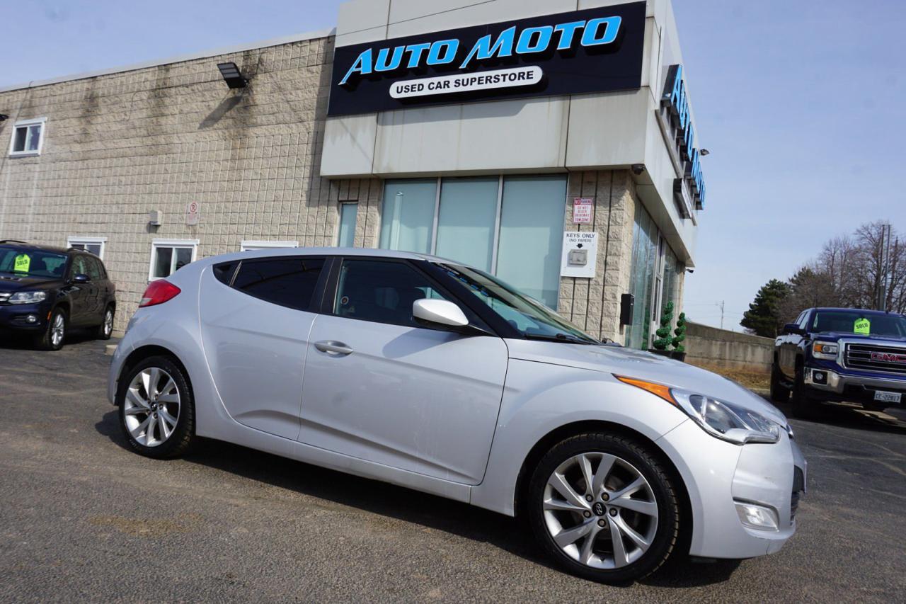 <div>*SAFETY INCLUDED*18 DETAILED SERVICE RECORDS*LOCAL ONTARIO CAR<span>*</span><span>LOW KMS</span><span>* </span><span>Very Clean Hyundai Veloster 1.6L 4Cyl with Automatic Transmission Bluetooth, Cruise Controls, Alloys. Silver On Black Interior. Fully Loaded with: Power Windows, Power Locks, Power Mirrors, CD/AUX, AC, Dual Climate Control, Alloys, Keyless Entry, Side Turning Signals, Steering Mounted Controls, Power Front Seats, Bluetooth,</span><span> and ALL THE POWER OPTIONS!! </span></div><pre><p><span>-------------------------------------------------</span><br /><span>Financing options are available start from 6.96% with $0 Down payment O.A.C.</span><br /><span>-------------------------------------------------</span><br /><span>SAFETY CERTIFICATION INCLUDED*** Vehicle comes with: Safety Certification, and Car Fax Report ALL INCLUDED!! At no extra cost to you!! Dont miss this opportunity to own a high-quality, pre-owned vehicle. </span><br /><span>-------------------------------------------------</span><br /><span>Additionally, our vehicles qualify for up to 4 years of extended warranty. Please speak to your sales representative for more information.</span><br /><span>-------------------------------------------------</span><br /><span>We are open Monday to Saturday from 10am - 6pm, Sundays Closed.</span><br /><span>-------------------------------------------------</span><br /><span>We also welcome trade-ins, with on-site buyers available to estimate your vehicle on the same day.</span><br /><span>-------------------------------------------------</span><br /><span>Visit us at 3219 Harvester Road, Burlington, L7N 3N8 or call us at Nine O Five-281-2255 for more information.</span><br /><span>------------------------------------------------</span><br /><span>Check our inventory at www automotoinc ca</span></p></pre>