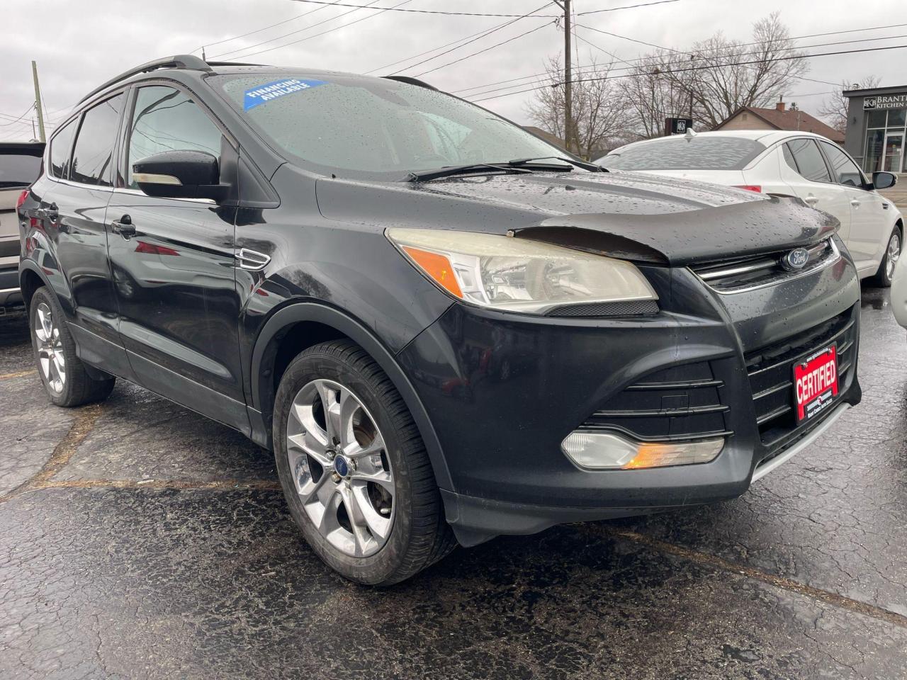 <p>CERTIFIED WITH 2 YEAR WARRANTY INCLUDED!!! NO ACCIDENTS, leather package and sunroof !!</p><p>WE FINANCE EVERYONE REGARDLESS OF CREDIT !!!</p><p>VOTED BRANTFORDS BEST USED CAR DEALER 2024 !!!!</p><p>Ready for adventure? This 2013 Ford Escape 4WD SEL is a rugged and reliable companion for all your journeys. This black beauty with a sleek black interior boasts a powerful 2.0L 4-cylinder engine, ready to tackle any terrain with its 4-wheel drive system. With 180,000km on the odometer, this Escape has seen its fair share of the road, proving its durability and dependability.</p><p>Get behind the wheel and enjoy the comfort of leather seats, heated mirrors for those chilly mornings, and a sunroof to soak in the sunshine. Stay connected and entertained with the built-in GPS navigation and CD player. This Escape is loaded with features, making every drive a pleasure.</p><p>Visit Right Choice Auto today to experience this versatile and well-maintained Ford Escape for yourself.</p><p><strong>Five features with the most sizzle:</strong></p><ul><li><strong>4-wheel drive system:</strong> Conquer any terrain with confidence.</li><li><strong>Leather seats:</strong> Enjoy luxurious comfort on every drive.</li><li><strong>Heated mirrors:</strong> Stay warm and safe even on cold mornings.</li><li><strong>GPS navigation:</strong> Never get lost again.</li><li><strong>Sunroof:</strong> Experience open-air driving at its finest.</li></ul><p><em>Powered by AutoIntelligence™ AI</em></p>