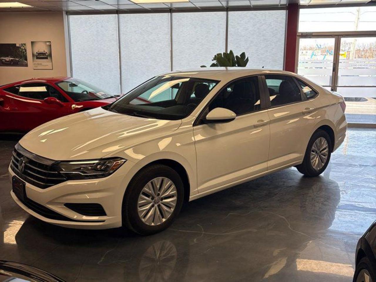 Come see this certified 2019 Volkswagen Jetta Comfortline | Heated Seats | CarPlay + Android | Reverse Camera | and More !. Its Automatic transmission and 1.4 L engine will keep you going. This Volkswagen Jetta comes equipped with these options: Reverse Camera, Air Conditioning, Heated Seats, Tilt Steering Wheel, Steering Radio Controls, Power Windows, Power Locks, Traction Control, Power Mirrors, and Android Auto / Apple CarPlay. Test drive this vehicle at Mark Wilsons Better Used Cars, 5055 Whitelaw Road, Guelph, ON N1H 6J4.60+ years of World Class Service!450+ Live Market Priced VEHICLES! ONE MASSIVE LOCATION!Free Local Delivery Available!FINANCING! - Better than bank rates! 6 Months No Payments available on approved credit OAC. Zero Down Available. We have expert licensed credit specialists to secure the best possible rate for you and keep you on budget ! We are your financing broker, let us do all the leg work on your behalf! Click the RED Apply for Financing button to the right to get started or drop in today!BAD CREDIT APPROVED HERE! - You dont need perfect credit to get a vehicle loan at Mark Wilsons Better Used Cars! We have a dedicated licensed team of credit rebuilding experts on hand to help you get the car of your dreams!WE LOVE TRADE-INS! - Top dollar trade-in values!SELL us your car even if you dont buy ours! HISTORY: Free Carfax report included.Certification included! No shady fees for safety!EXTENDED WARRANTY: Available30 DAY WARRANTY INCLUDED: 30 Days, or 3,000 km (mechanical items only). No Claim Limit (abuse not covered)5 Day Exchange Privilege! *(Some conditions apply)CASH PRICES SHOWN: Excluding HST and Licensing Fees.2019 - 2024 vehicles may be daily rentals. Please inquire with your Salesperson.We have made every reasonable attempt to ensure options are correct but please verify with your sales professional