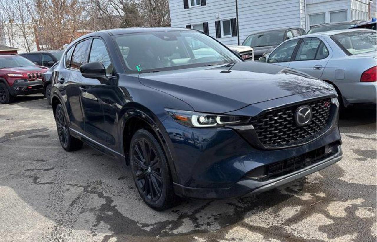 Look at this certified 2022 Mazda CX-5 Sport Design | Leather | Nav | Sunroof | HUD | Adaptive Cruise | Heated Steering + Seats | CarPlay . Its Automatic transmission and 2.5 L engine will keep you going. This Mazda CX-5 comes equipped with these options: Sunroof, Sport Package, Navigation System, Leather, Heated Steering Wheel, Heads Up Display, Air Conditioning, Adaptive Cruise Control, Heated Seats, and Tilt Steering Wheel. See it for yourself at Mark Wilsons Better Used Cars, 5055 Whitelaw Road, Guelph, ON N1H 6J4.60+ years of World Class Service!450+ Live Market Priced VEHICLES! ONE MASSIVE LOCATION!Free Local Delivery Available!FINANCING! - Better than bank rates! 6 Months No Payments available on approved credit OAC. Zero Down Available. We have expert licensed credit specialists to secure the best possible rate for you and keep you on budget ! We are your financing broker, let us do all the leg work on your behalf! Click the RED Apply for Financing button to the right to get started or drop in today!BAD CREDIT APPROVED HERE! - You dont need perfect credit to get a vehicle loan at Mark Wilsons Better Used Cars! We have a dedicated licensed team of credit rebuilding experts on hand to help you get the car of your dreams!WE LOVE TRADE-INS! - Top dollar trade-in values!SELL us your car even if you dont buy ours! HISTORY: Free Carfax report included.Certification included! No shady fees for safety!EXTENDED WARRANTY: Available30 DAY WARRANTY INCLUDED: 30 Days, or 3,000 km (mechanical items only). No Claim Limit (abuse not covered)5 Day Exchange Privilege! *(Some conditions apply)CASH PRICES SHOWN: Excluding HST and Licensing Fees.2019 - 2024 vehicles may be daily rentals. Please inquire with your Salesperson.