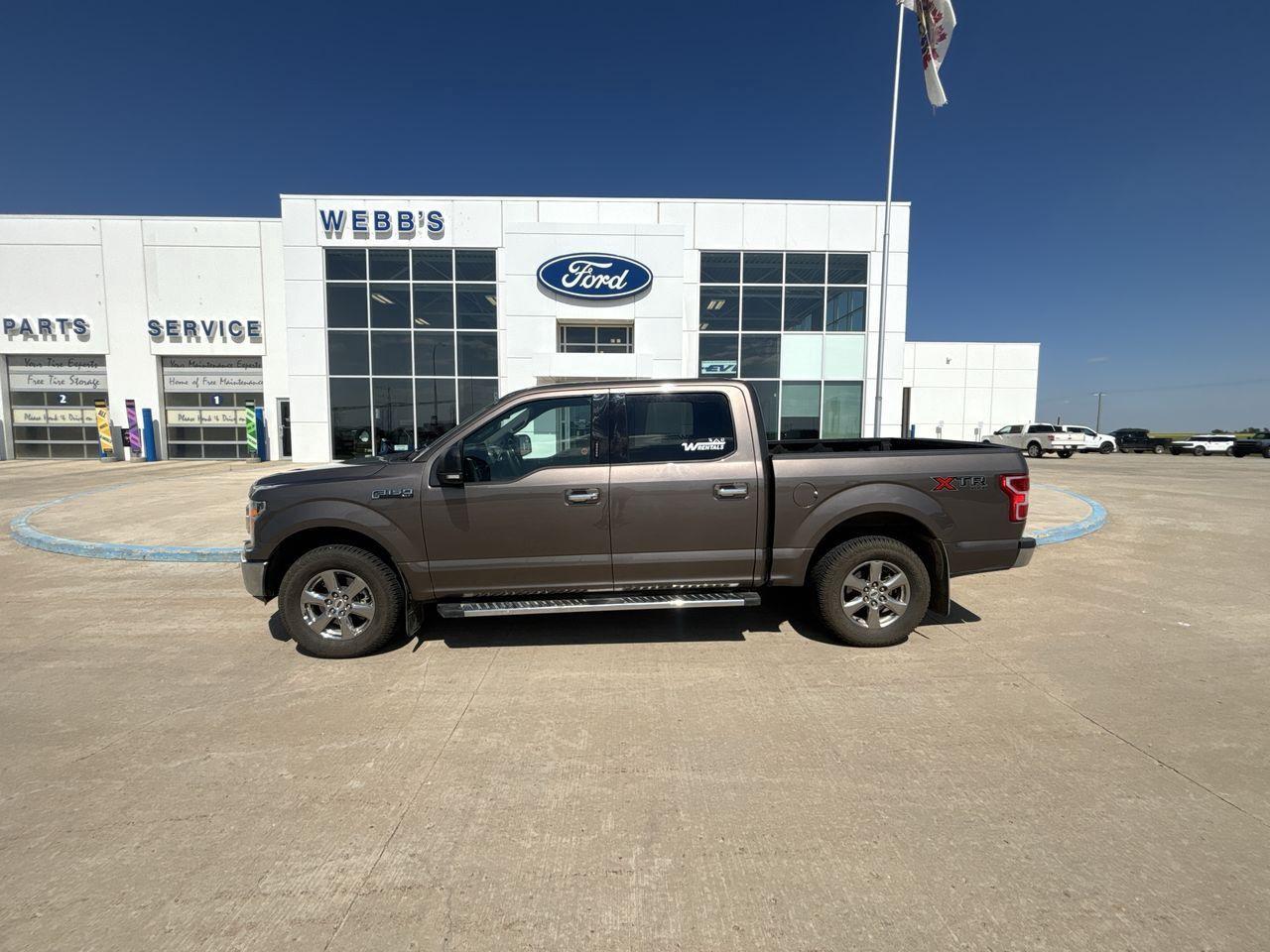<p>Looking for a reliable and capable pickup truck? Check out this 2020 Ford F-150 XLT 4WD SuperCrew, available now at Webbs 1441. This rugged truck, boasting a sleek D1-21/STONE_GREY exterior, is ready to tackle any job or adventure. With its spacious SuperCrew cab and practical 5.5 box, youll have plenty of room for passengers and cargo. This F-150 has 183088KM on the odometer.</p>
<p>This Ford F-150 is equipped with a fuel-efficient Flex Fuel engine and a smooth-shifting automatic transmission, making every drive a pleasure. The 4-Wheel Drive system ensures confident handling in various conditions, from city streets to off-road trails. This truck is built to handle whatever you throw at it.</p>
<p>Here are some of the standout features of this impressive F-150:</p>
<ul>
<li><strong>Commanding 4-Wheel Drive:</strong> Conquer any terrain with confidence, thanks to the robust 4-wheel drive system.</li>
<li><strong>Spacious SuperCrew Cab:</strong> Bring the whole crew along in comfort with the roomy SuperCrew cab.</li>
<li><strong>Versatile 5.5 Box:</strong> Easily haul your gear with the practical 5.5 box, perfect for work or play.</li>
<li><strong>Fuel-Efficient Flex Fuel Engine:</strong> Enjoy a balance of power and efficiency with the Flex Fuel engine.</li>
<li><strong>Automatic Transmission:</strong> Experience effortless driving with the smooth and responsive automatic transmission.</li>
</ul>
<p><strong><em>Powered by AutoIntelligence</em></strong>
Powered by AutoIntelligence</p>
