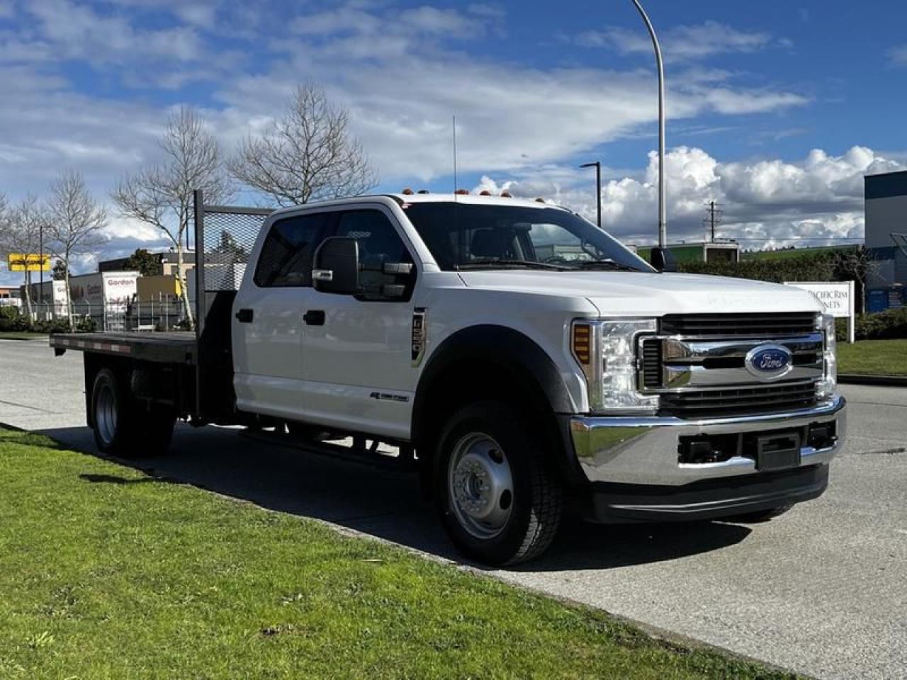 2019 Ford F-550 12 Foot Flat Deck 4WD Diesel, 6.7L, 8 cylinder, 4 door, automatic, 4WD, cruise control, air conditioning, AM/FM radio, power door locks, power windows, white exterior, tan interior, cloth. Certification and Decal valid until March 2025.

Flatdeck Measurements
11FT 10 Long
7FT 10 Wide  $69,930.00 plus $375 processing fee, $70,305.00 total payment obligation before taxes.  Listing report, warranty, contract commitment cancellation fee, financing available on approved credit (some limitations and exceptions may apply). All above specifications and information is considered to be accurate but is not guaranteed and no opinion or advice is given as to whether this item should be purchased. We do not allow test drives due to theft, fraud, acts of vandalism and undetectable impaired driving. Instead we provide the following benefits: Complimentary Warranty (with options to extend), Limited Money Back Satisfaction Guarantee on Fully Completed Contracts, Contract Commitment Cancellation, and an Open-Ended Sell-Back Option. Ask seller for details or call 604-522-REPO(7376) to confirm listing availability.