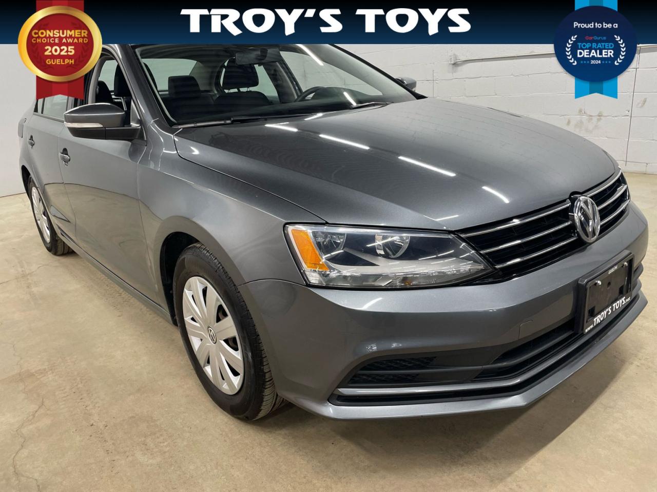 <p>Looking for a reliable and affordable sedan? Look no further than this 2016 Volkswagen Jetta Trendline, available now at Troys Toys. This sleek gray sedan boasts a spacious and comfortable interior with gray cloth seats, perfect for everyday commutes and weekend adventures. Under the hood, the Jetta packs a punch with a powerful engine, paired with a smooth automatic transmission, ensuring a smooth and efficient ride.</p><p>This well-maintained Jetta has been driven 117,065km and is packed with features that enhance both safety and convenience. Enjoy peace of mind with its comprehensive safety suite, including anti-lock brakes, stability control, and multiple airbags. Stay connected and entertained with the built-in CD player, auxiliary audio input, and steering wheel audio controls. The Jetta also includes a rear-view camera for added peace of mind when parking or reversing.</p><p>Here are just a few of the Jettas most enticing features:</p><ul><li><strong>Back-Up Camera:</strong> Navigate tight spaces with ease and confidence, thanks to the clear and convenient rear-view camera.</li><li><strong>Stability Control:</strong> Maintain control in challenging driving conditions with the stability control system, keeping you and your passengers safe.</li><li><strong>Steering Wheel Audio Controls:</strong> Enjoy the convenience of changing tracks and volume without taking your hands off the wheel.</li><li><strong>Tilt Steering Wheel:</strong> Find your perfect driving position with the adjustable tilt steering wheel, for a comfortable and personalized ride.</li><li><strong>Power Windows:</strong> Enjoy the convenience of power windows, for easy access and ventilation in any weather.</li></ul><p><em>Powered by AutoIntelligence™ AI</em></p>