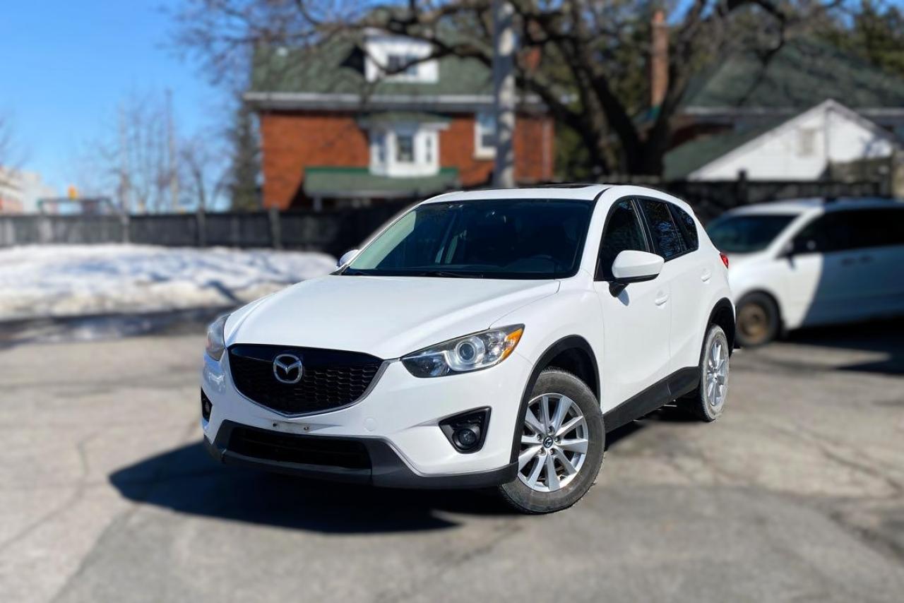 <p>Looking for a reliable and stylish ride? Check out this 2014 Mazda CX-5 Touring! With its sleek design, fuel-efficient 2.5L engine, and smooth handling, this SUV offers the perfect balance of performance and practicality. Packed with features like a sunroof, Bluetooth connectivity, backup camera, and leather seats, it’s perfect for both city driving and weekend adventures. Plus, with its low mileage and well-maintained condition, this CX-5 is ready to hit the road for many more miles. Don’t miss out on this great deal—come take it for a spin today!</p><p>Finance Disclaimer: Finance pricing on this website is for website display purpose only. Please contact our office to confirm final pricing. Although the intention is to capture current prices as of the date of publication, pricing is subject to change without notice, and may not be accurate or completely current. While every reasonable effort is made to ensure the accuracy of this data, we are not responsible for any errors or omissions contained on these pages. Please verify any information in question with a dealership sales representative. Information provided at this site does not constitute a guarantee of available prices or financing rate. See dealer for actual prices, payment, and complete details. <br /><br />We invite you to see this vehicle at Presleys Auto Showcase on Carling Avenue just west of Island Park Drive. Call us today to book a test drive.TAXES AND LICENSE FEES ARE EXTRA.Ask us about our NO CHARGE limited Powertrain Warranty. This is for a limited time only. **Some conditions do apply.This vehicle will come with an Ontario Safety or Quebec Inspection.If you are looking to finance a car, Presleys Auto Showcase is your Ottawa, Ontario source for speedy online credit approval at the best car financing rates possible. Presleys Auto Showcase can pre-approve your car loan, even if your good credit rating has been compromised because of bad credit, low credit score, bankruptcy, repossession, collections or late payments. We also specialize in fast car loans for those who are retired, self employed, divorced, new immigrants or students. Let the knowledgeable and helpful auto loan specialists at Presleys Auto Showcase give you the personal touch.</p>