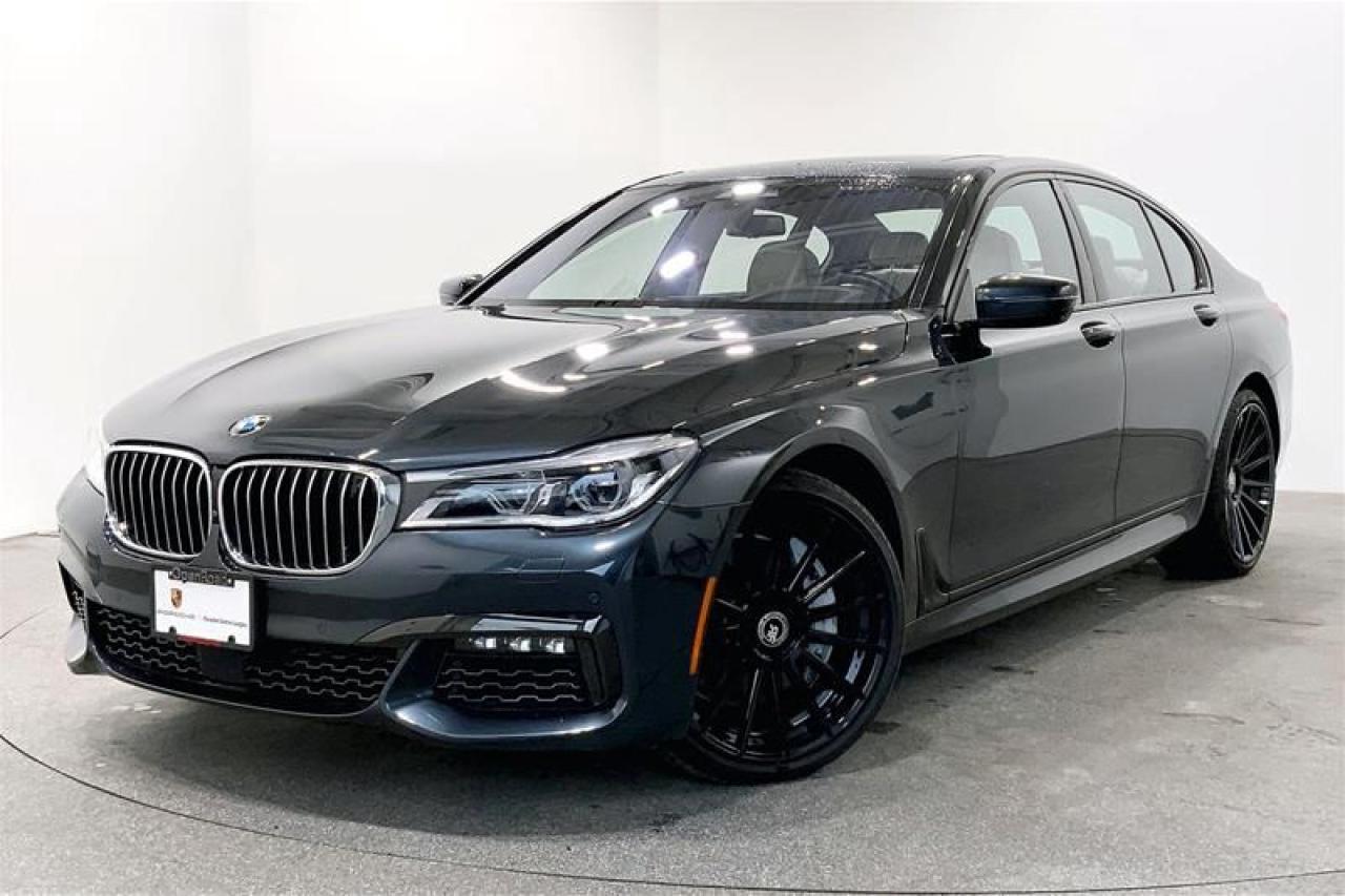 Welcoming this Dynamic 2017 BMW 750i xDrive in Singapore Grey Metallic with an Ivory White/Black Extended Nappa Leather Interior. This vehicle comes highly equipped with options including the Executive Package, Driver Assistance Package, Dynamic Handling Package, M Sport Package, M Aerodynamics Package, Surround View, Massage Function on Driver Seat, Ventilated Front Seats, and much more! This Local BC Vehicle has No Reported Accidents or Claims! We Accept All Trade-Ins and Buy-Ins!! For more details or to schedule a test drive with one of our highly trained sales executives please call or send a website enquiry now before it is gone. 604-530-8911. Porsche Center Langley has won the prestigious Porsche Premier Dealer Award eight years in a row. We are centrally located just a short distance from Highway 1 in beautiful Langley, British Columbia. Our hope is to have you driving your dream vehicle soon. Please note that additional fees, including a $599 documentation fee & a $690 dealer prep fee, apply to all pre-owned vehicles. Dealer #40136